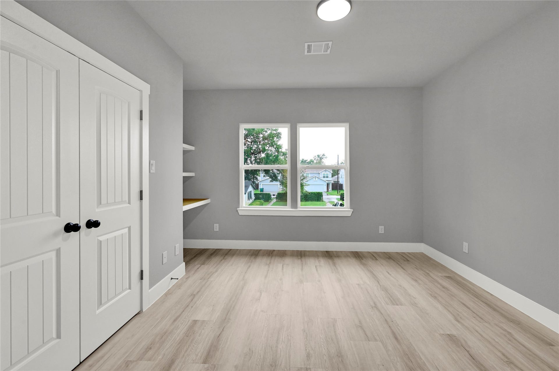 7415 Hezekiah Ln, #B, Houston, TX 77088 secondary bedroom with built ins.