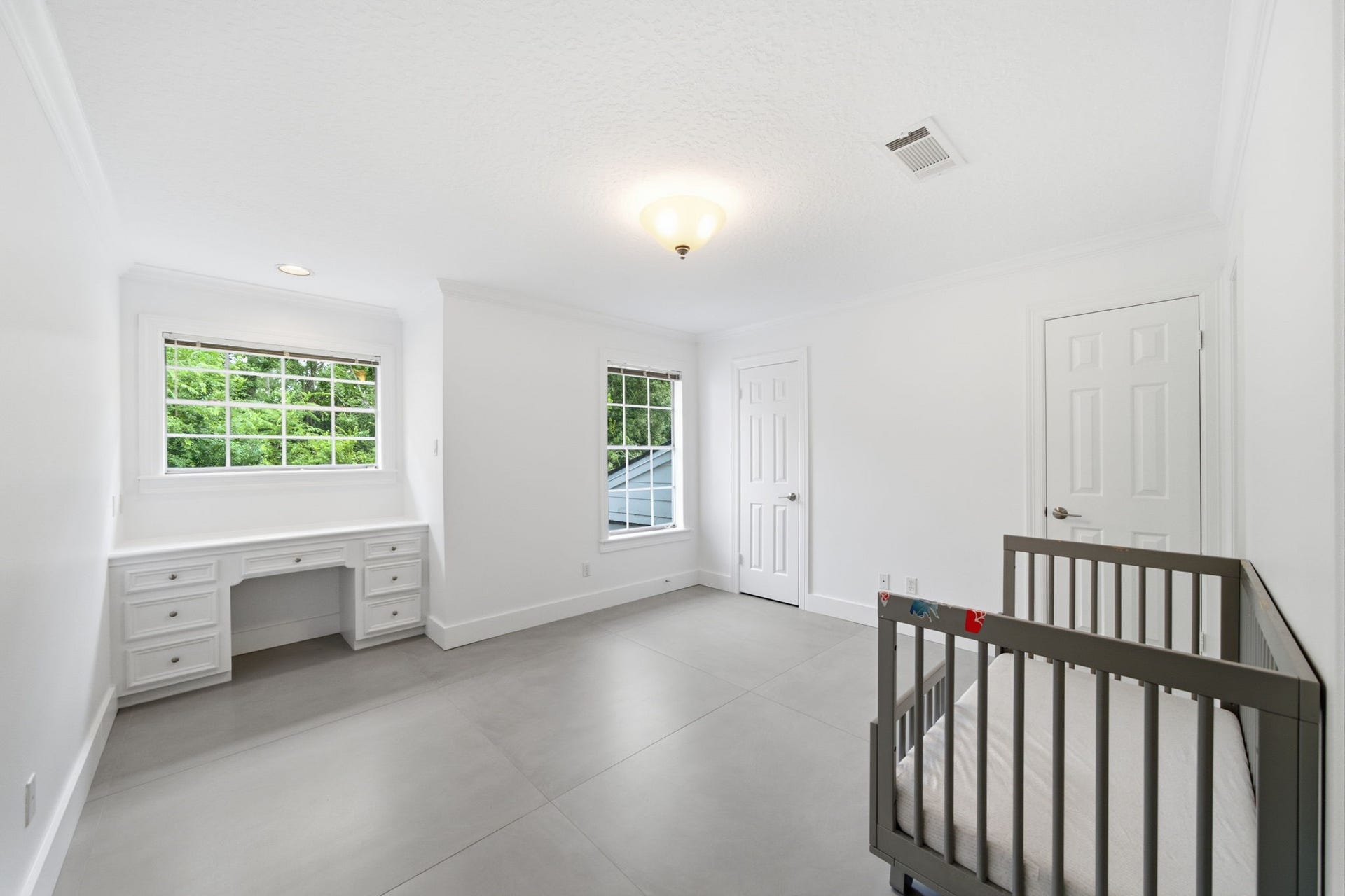 14 Hilshire Grove Lane, Hilshire Village, TX 77055 Guest Bedroom 3 with built in desk and 2 walk in closets. Private entrance to Jack and Jill style bath.