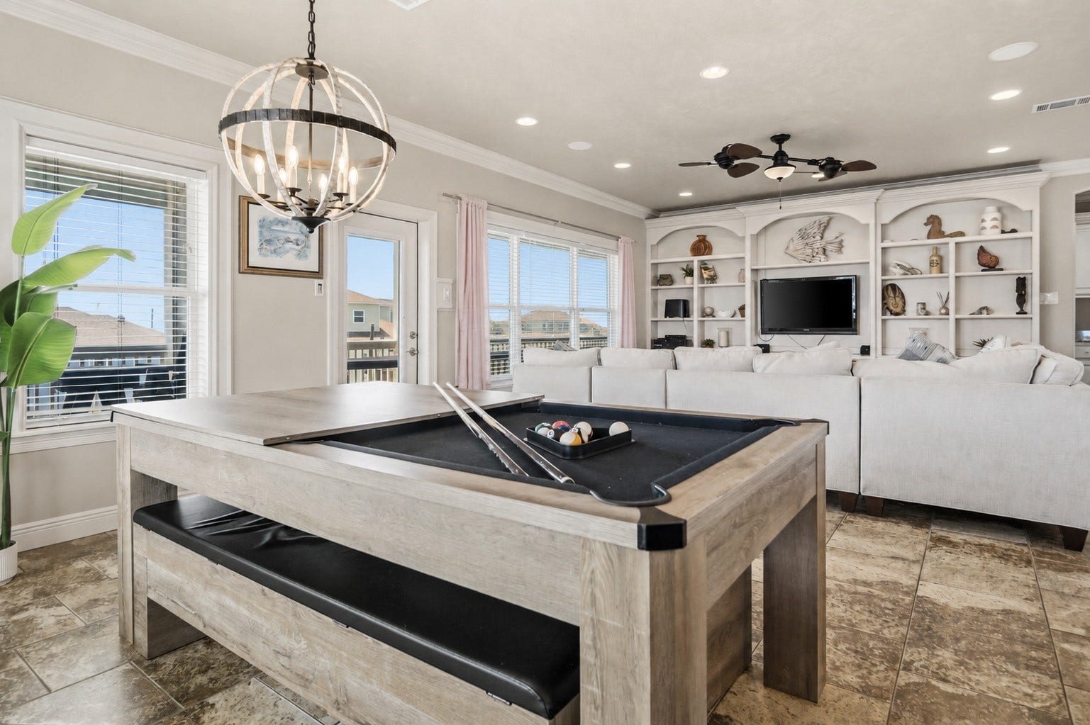 819 Eastview, Crystal Beach, TX 77650 Flip the dining table into a pool table whenever the competition starts, all while staying connected to the living room and balcony.