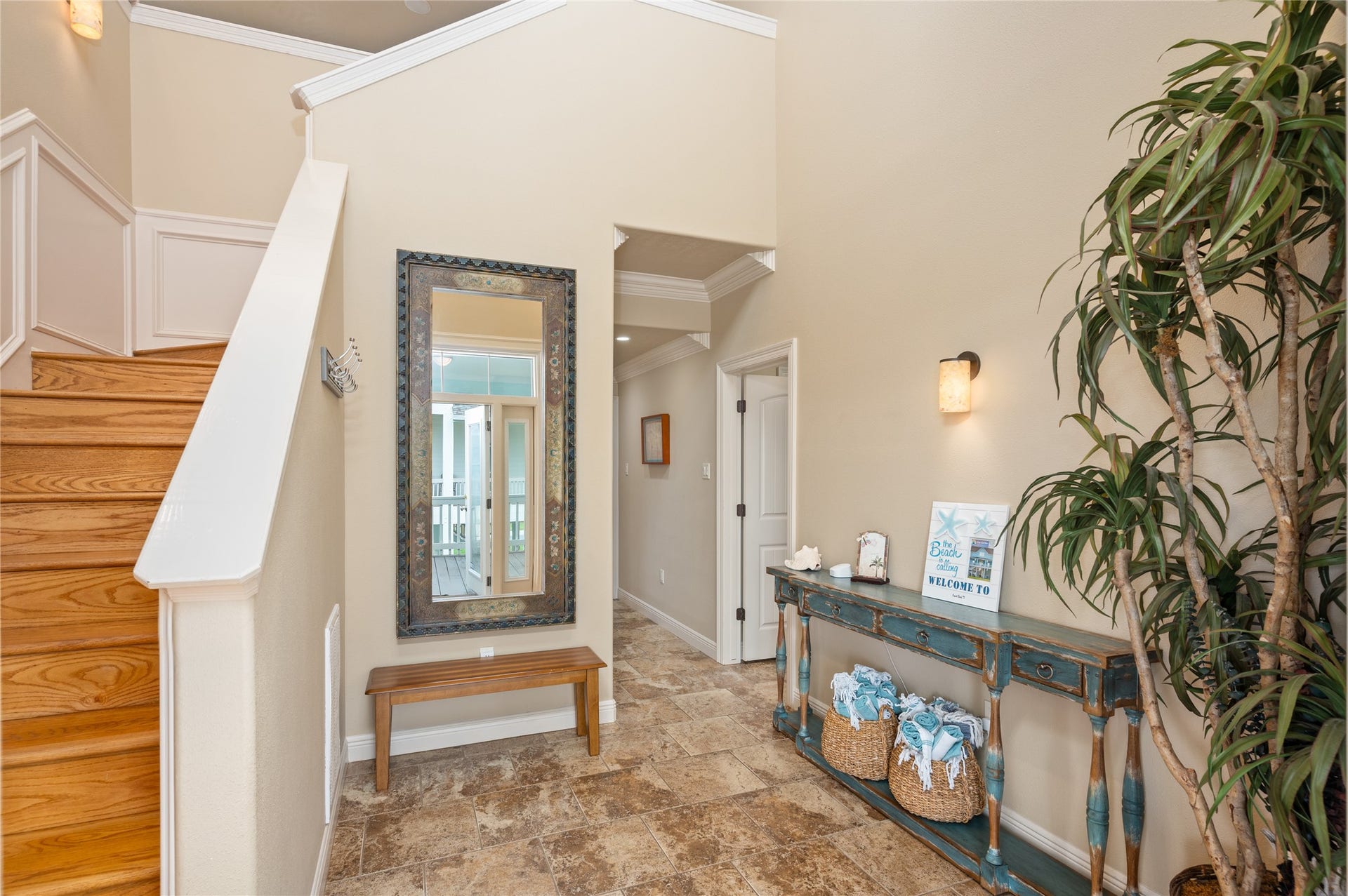 819 Eastview, Crystal Beach, TX 77650 Coming home feels effortless through this welcoming entry, where tile flooring and a convenient staircase lead you into the rest of your coastal retreat.