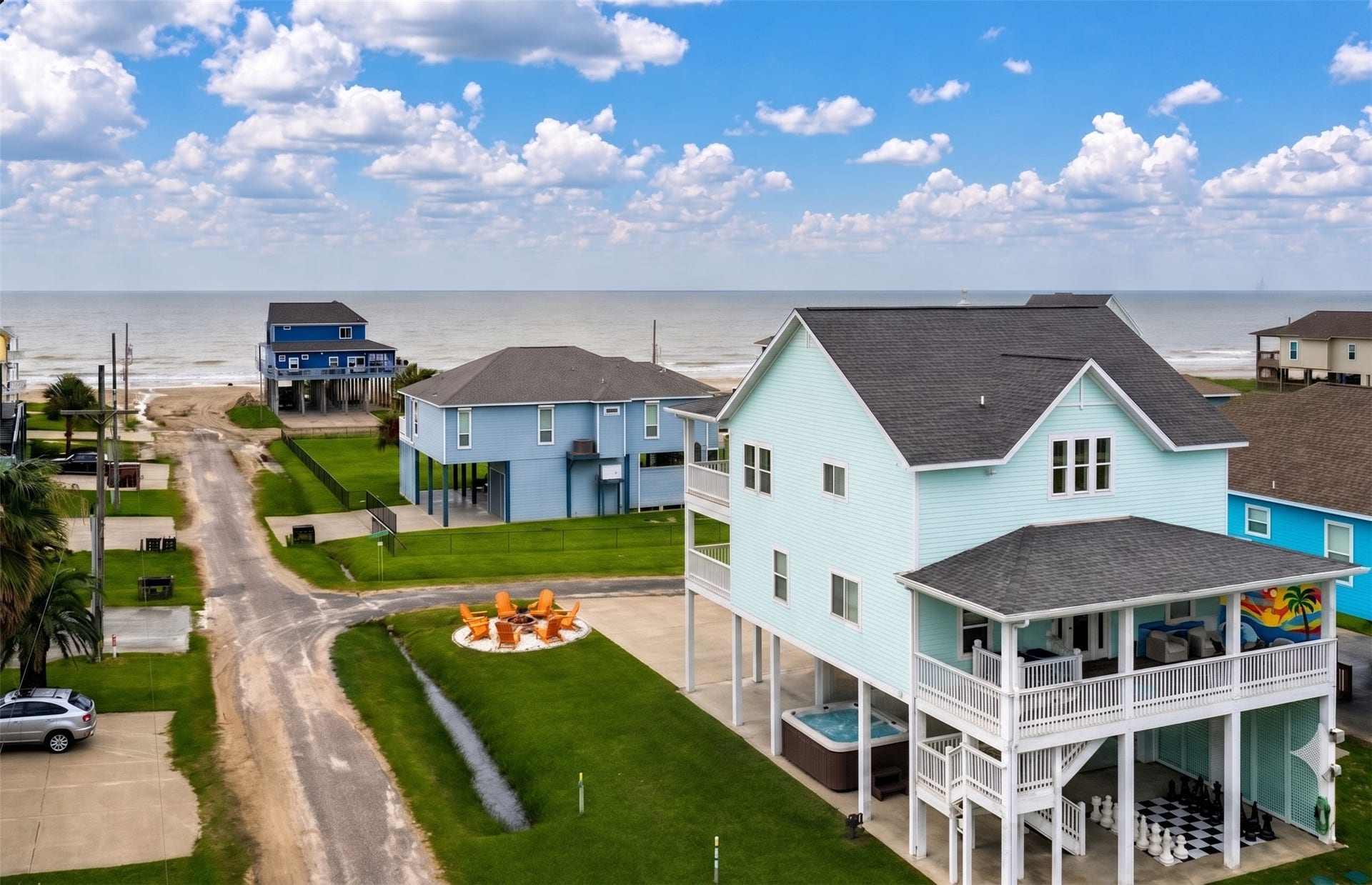 819 Eastview, Crystal Beach, TX 77650 This house is ready for fun! When you're back from the beach, enjoy the newly added firepit, hot tub, life-sized chess board, and mural on the shaded deck.
