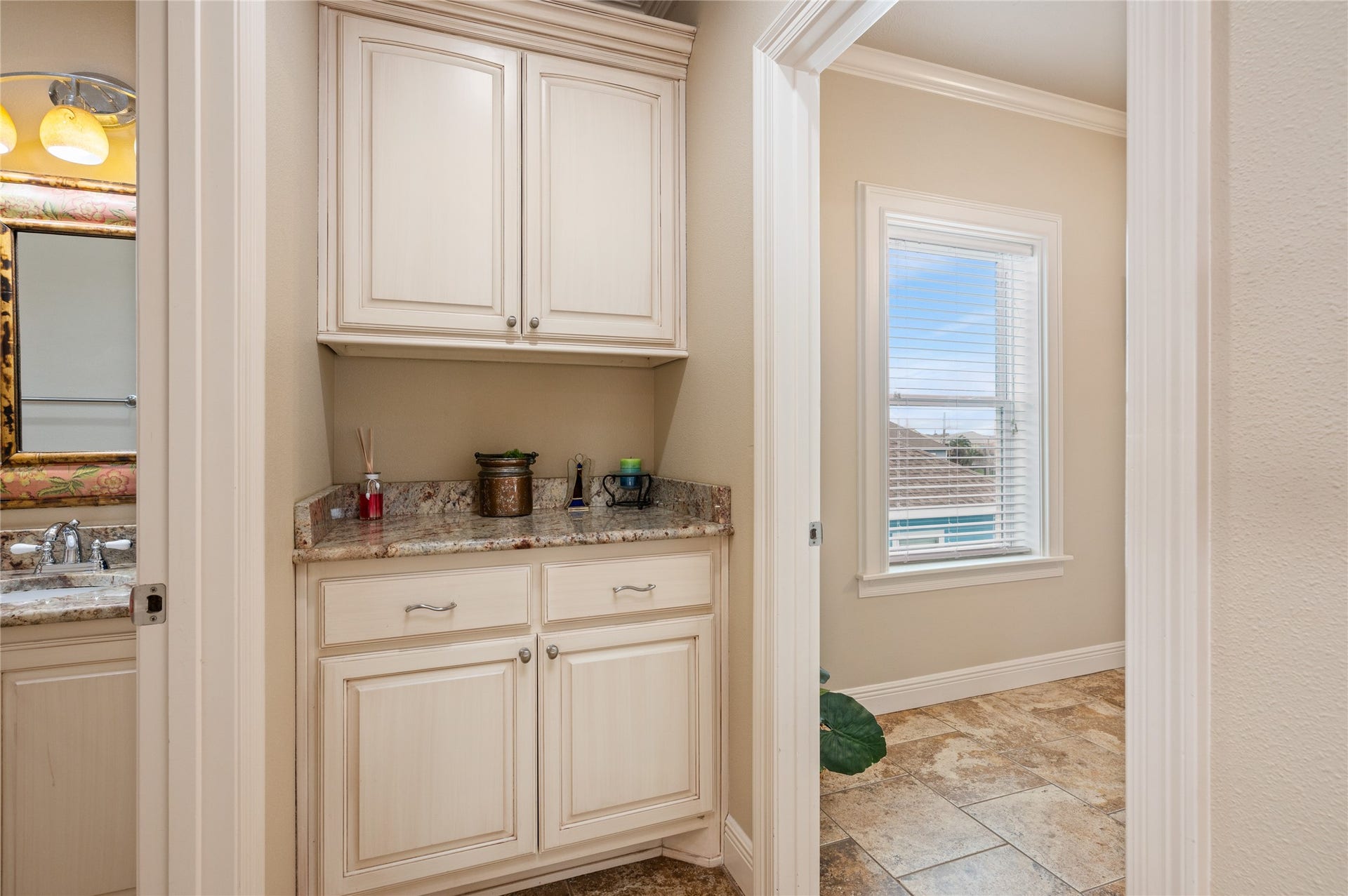 819 Eastview, Crystal Beach, TX 77650 Extra built-in cabinetry and counter space just outside the bath give you a convenient spot to keep essentials organized and tucked away.