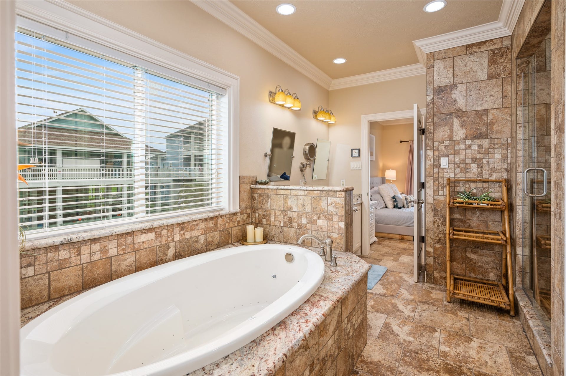 819 Eastview, Crystal Beach, TX 77650 Soak away the day in your jetted tub surrounded by warm tilework, with a spacious walk-in shower just steps away.