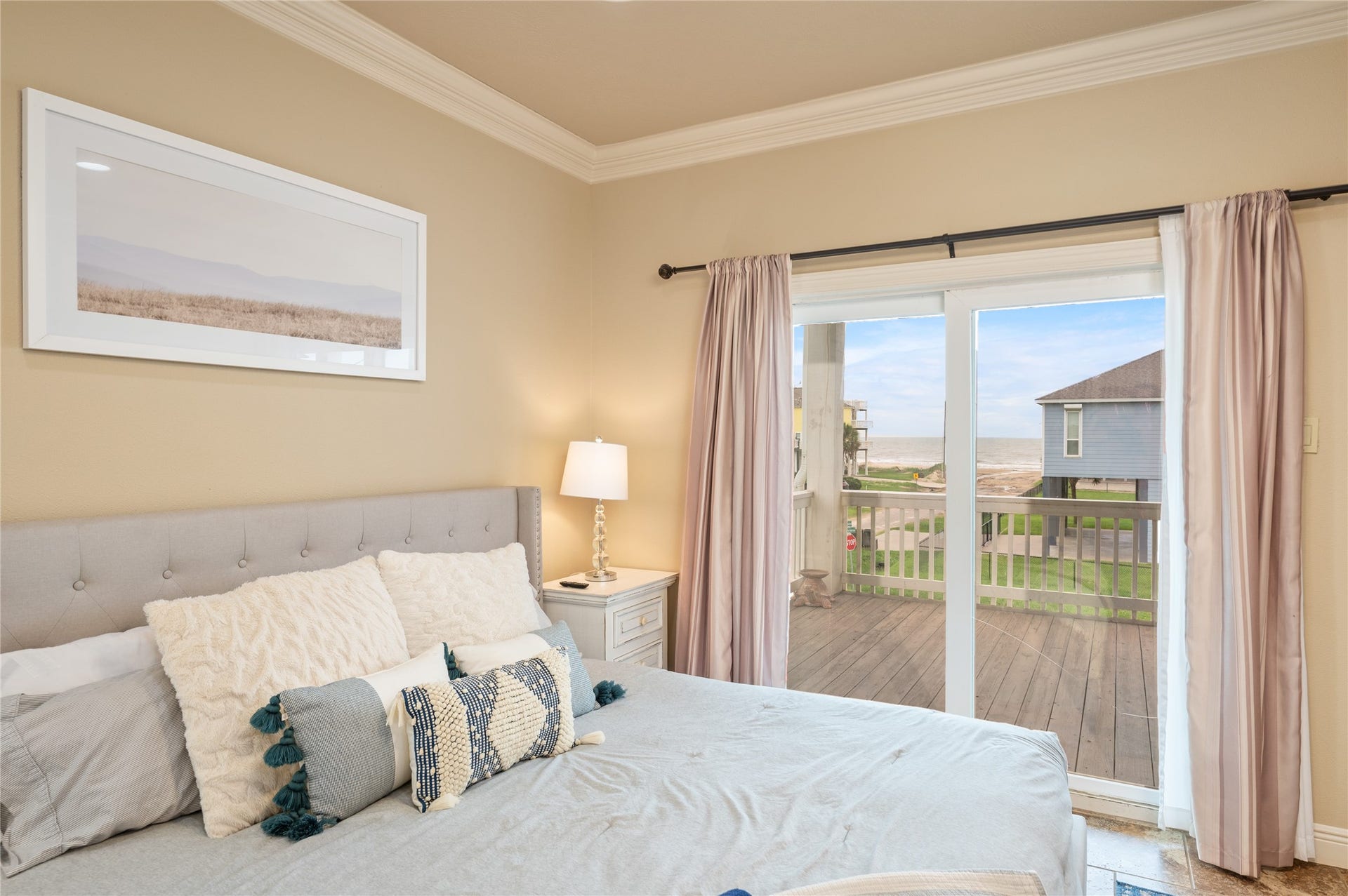 819 Eastview, Crystal Beach, TX 77650 Wake up to coastal views right from your primary bedroom, then step through the sliding doors onto your private covered deck.