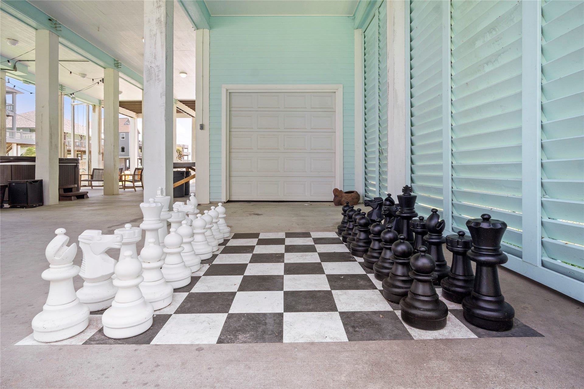 819 Eastview, Crystal Beach, TX 77650 Game time gets a larger-than-life upgrade with your oversized outdoor chess set tucked beneath the home.