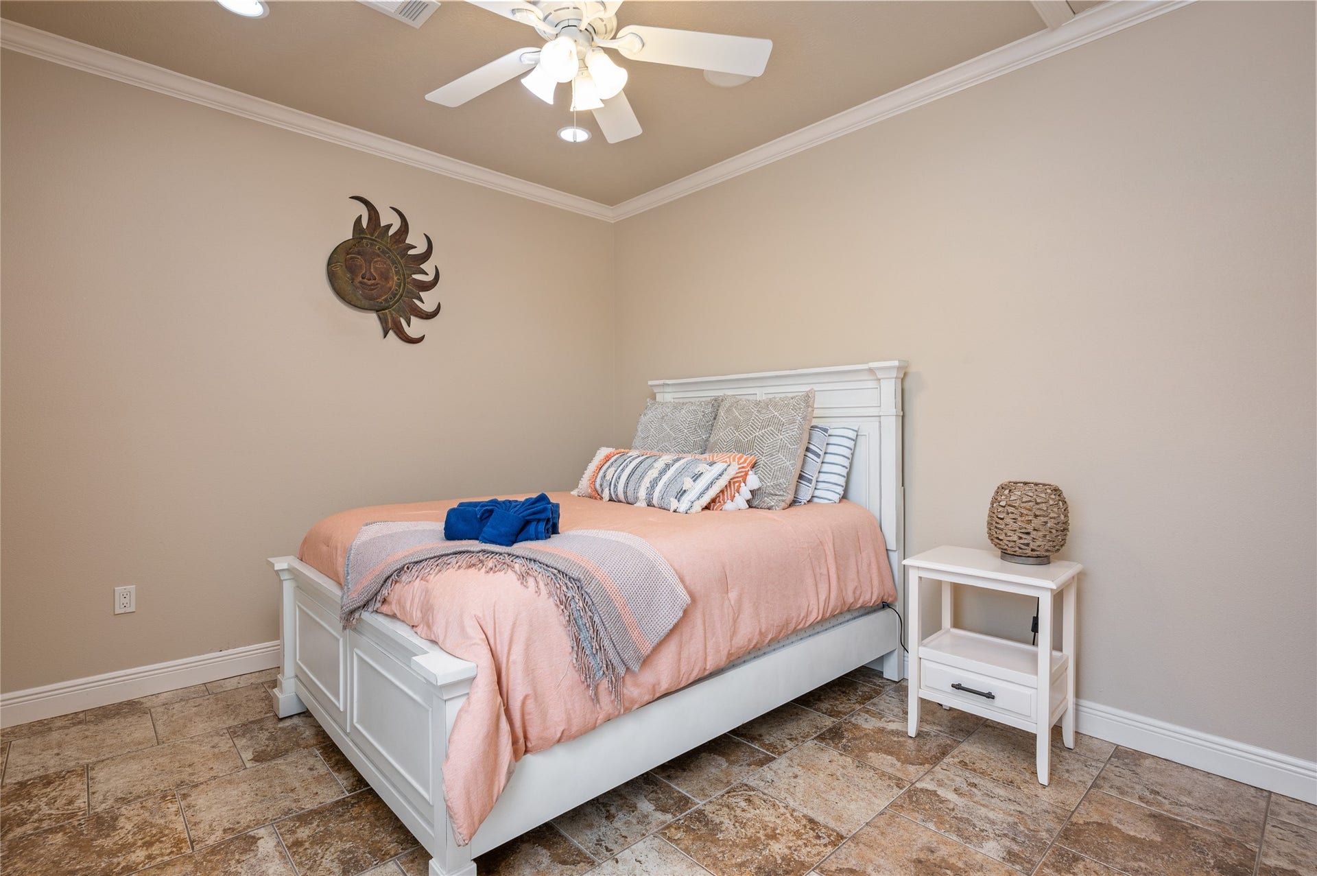 819 Eastview, Crystal Beach, TX 77650 Settle into this inviting bedroom where warm coastal touches, easy-care tile flooring, and a ceiling fan create a comfortable place to recharge.