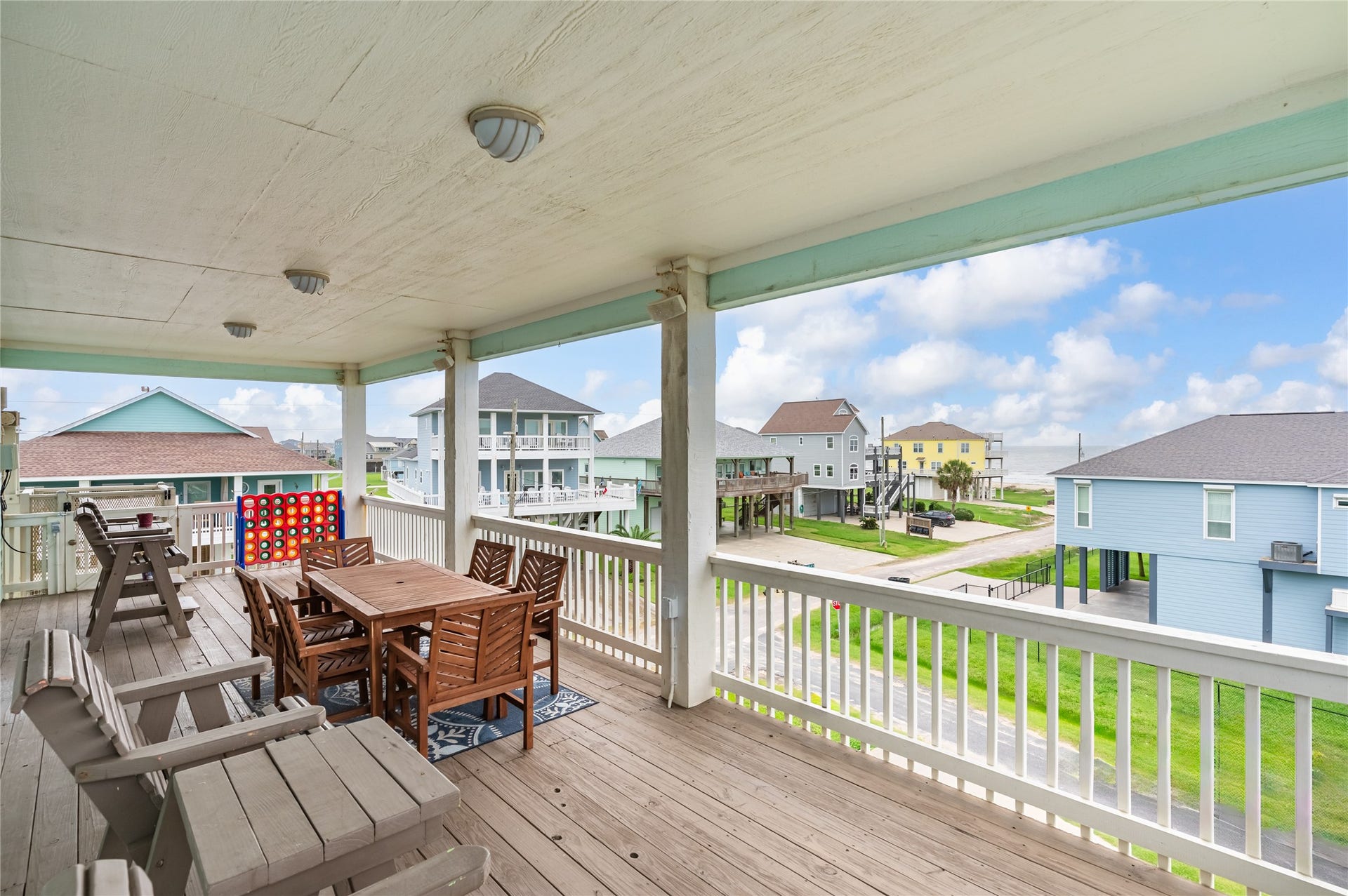 819 Eastview, Crystal Beach, TX 77650 Morning coffee comes with a Gulf view from this spacious covered balcony, with plenty of room to dine, lounge, and enjoy the coastal breeze.