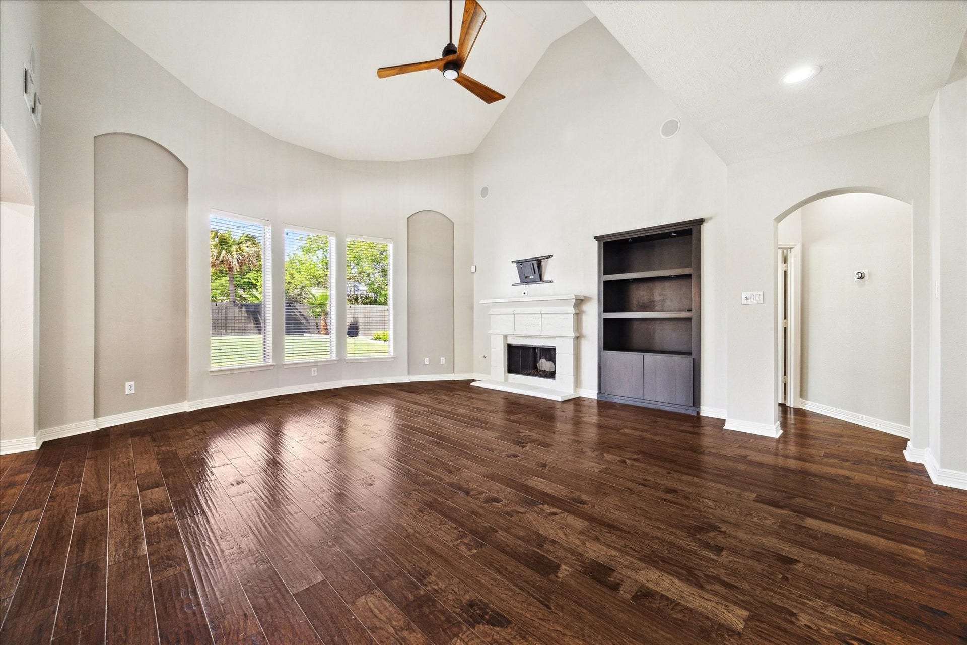 12006 Arcadia Bend Lane, Houston, TX 77041 Family room with well appointed cast-stone gas fireplace & custom celling fan