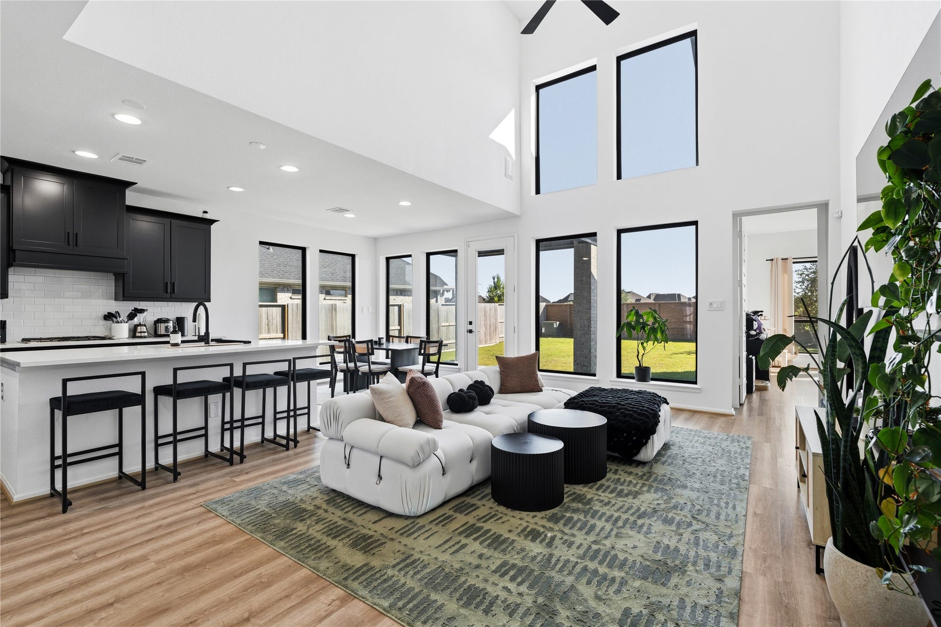 2427 Mount Healy Court, Katy, TX 77493 Living room perspective looking toward the kitchen, showcasing the seamless flow between cooking, dining, and gathering areas.