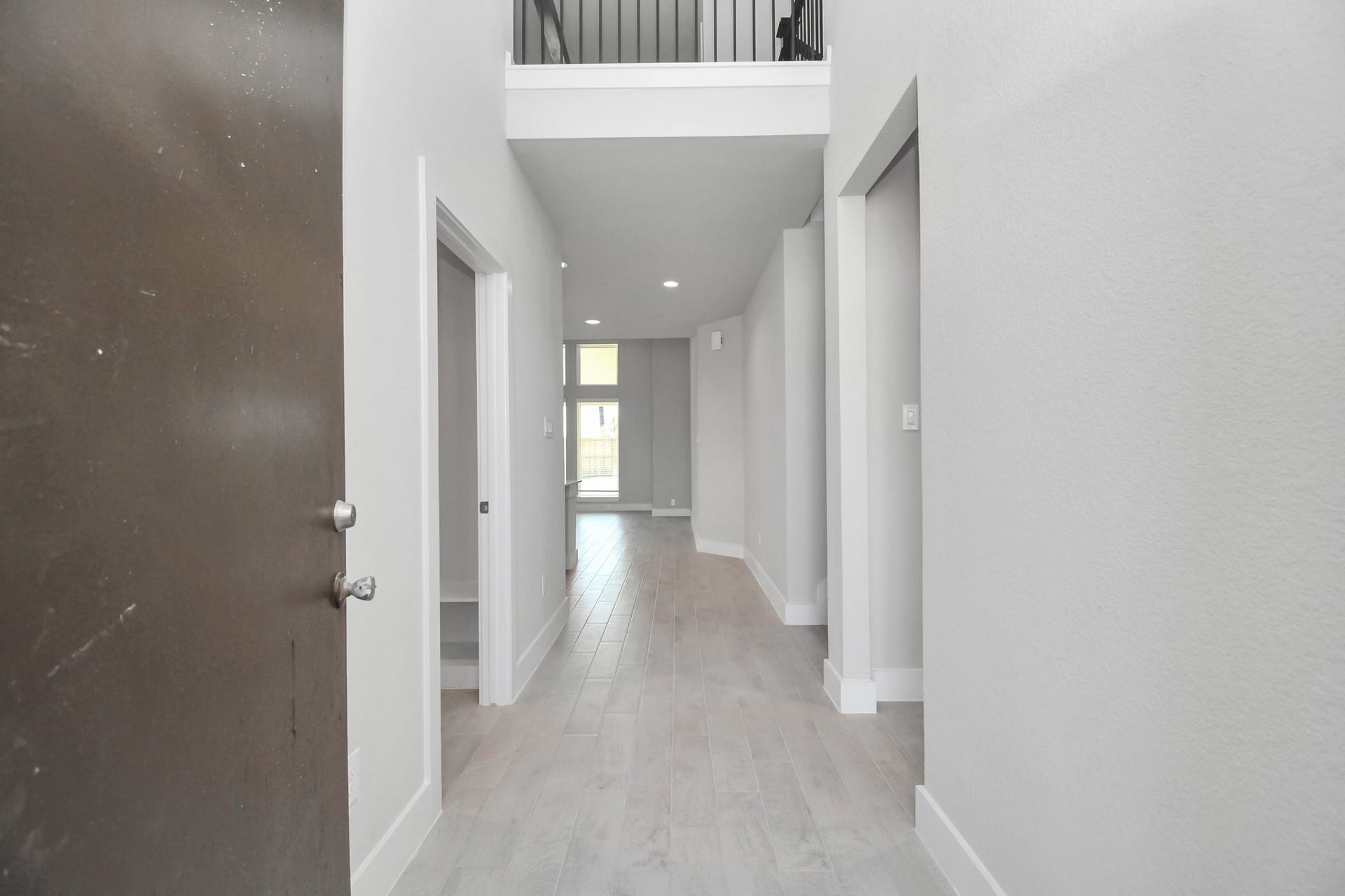 3114 Native Spring Drive, Spring, TX 77373 As you step into the threshold of this luxurious home, you'll soon be welcomed by an elegant glass door (to be installed). Inside, soaring ceilings amplify the spaciousness, while the refined wood-look tile flooring and oversized baseboards exude sophistication and charm. Sample photo of completed home with similar floor plan. Actual colors and selections may vary.