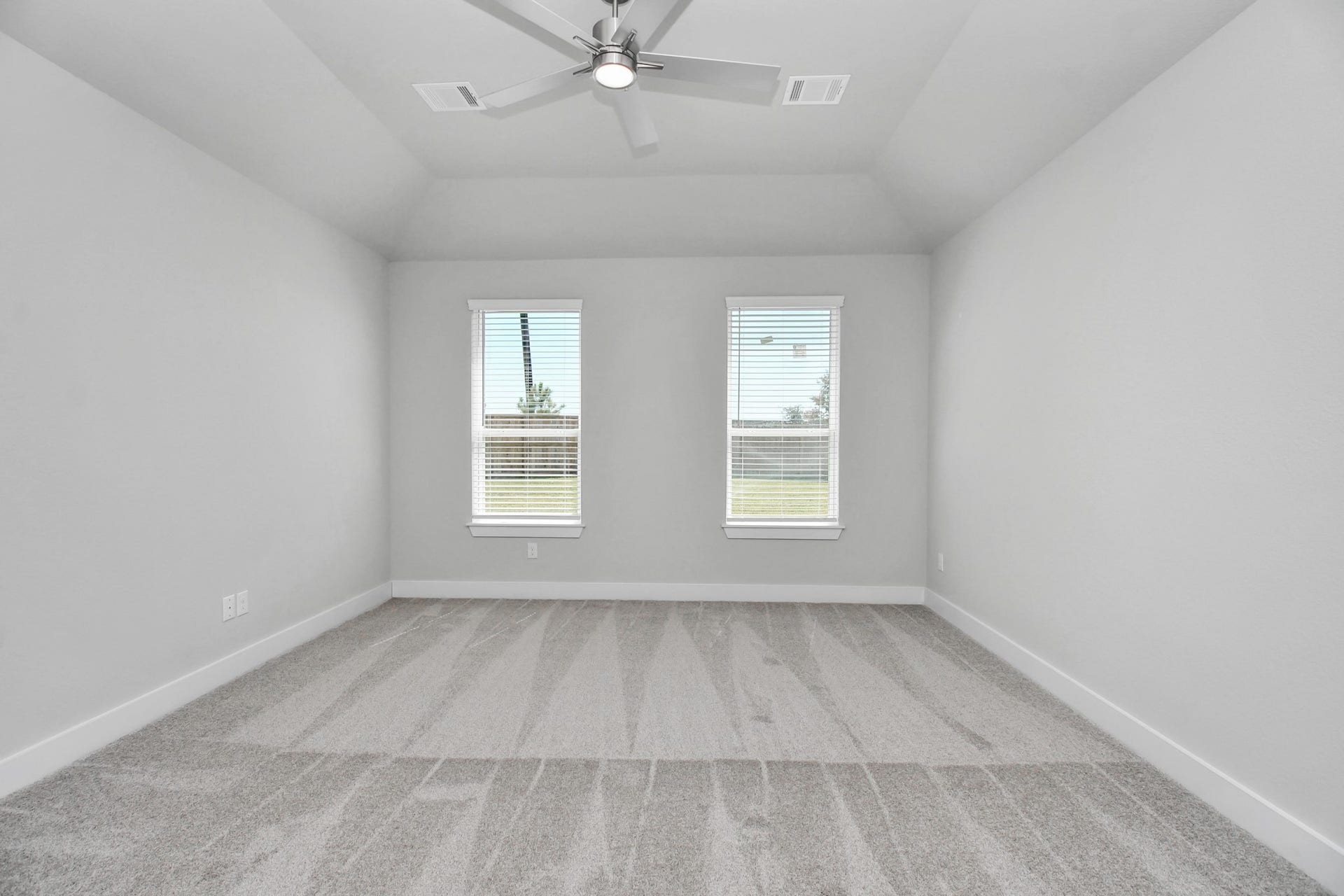 3114 Native Spring Drive, Spring, TX 77373 Escape to tranquility in this spacious primary room, adorned with plush carpeting and bathed in the soothing hues of warm paint colors, creating a cozy retreat for relaxation. Sample photo of completed home with similar floor plan. Actual colors and selections may vary.