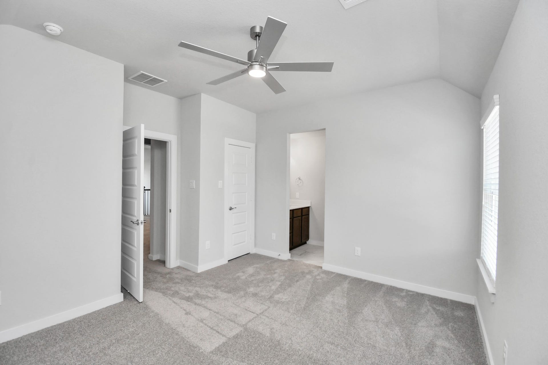 3114 Native Spring Drive, Spring, TX 77373 Generously sized secondary bedrooms featuring spacious closets, soft and inviting carpeting underfoot, large windows allowing plenty of natural light, and the added touch of privacy blinds for your personal retreat. Sample photo of completed home with similar floor plan. Actual colors and selections may vary.