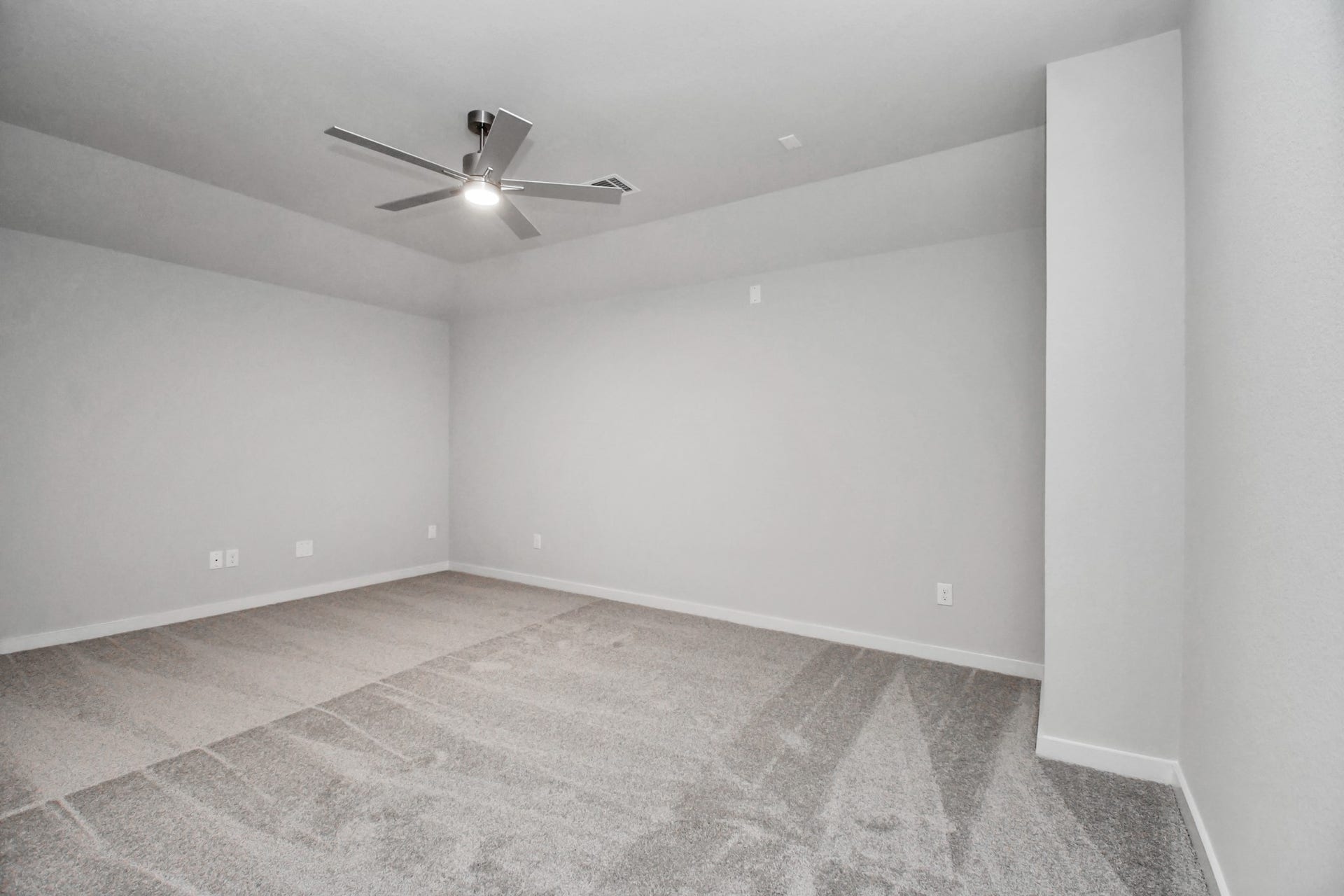 3114 Native Spring Drive, Spring, TX 77373 Secondary bedroom features plush carpeting, large windows that let in plenty of natural light, bright paint, and spacious closets. Sample photo of completed home with similar floor plan. Actual colors and selections may vary.