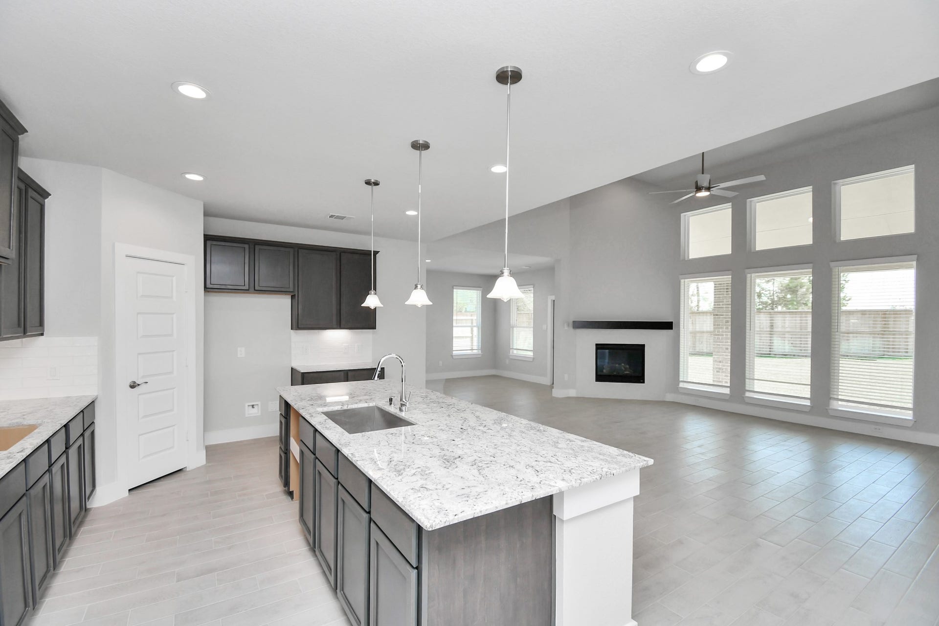 3114 Native Spring Drive, Spring, TX 77373 All of this overlooks your expansive family room, creating a perfect space for culinary delights and family gatherings. Sample photo of completed home with similar floor plan. Actual colors and selections may vary.