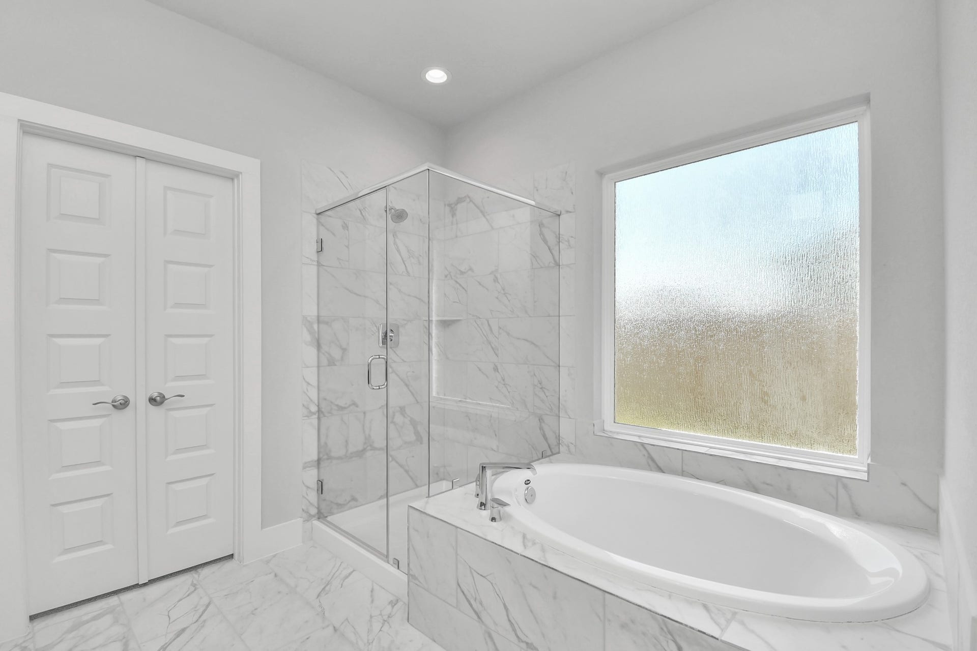 3114 Native Spring Drive, Spring, TX 77373 Indulge in a spa-like retreat within the confines of this primary bathroom. Delight in a spacious walk-in shower enveloped in stylish tile surround and unwind in a separate garden tub adorned with custom detailing. Sample photo of completed home with similar floor plan. Actual colors and selections may vary.