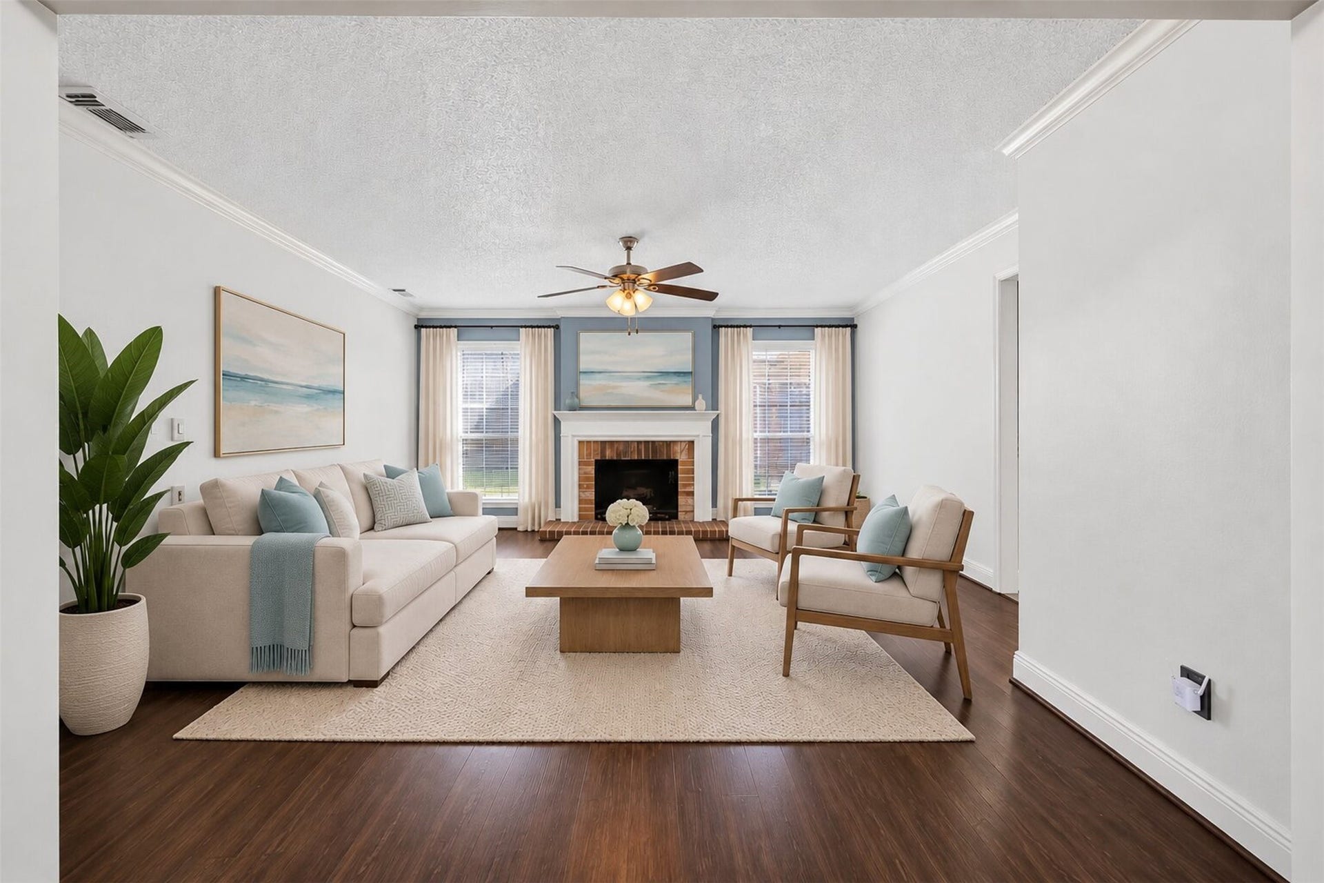 10215 Minturn Lane, Houston, TX 77064 Virtually staged living room highlighting the spacious layout, fireplace, and comfortable seating.