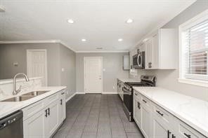 Chefs kitchen with lots of counter and storage space.