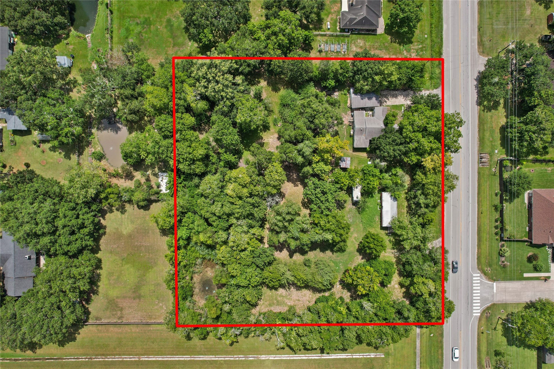 2305 Fm 1462 Road, Alvin, TX 77511 The property offers a mix of wooded and open areas, giving a future owner flexibility when considering potential development or continued use.