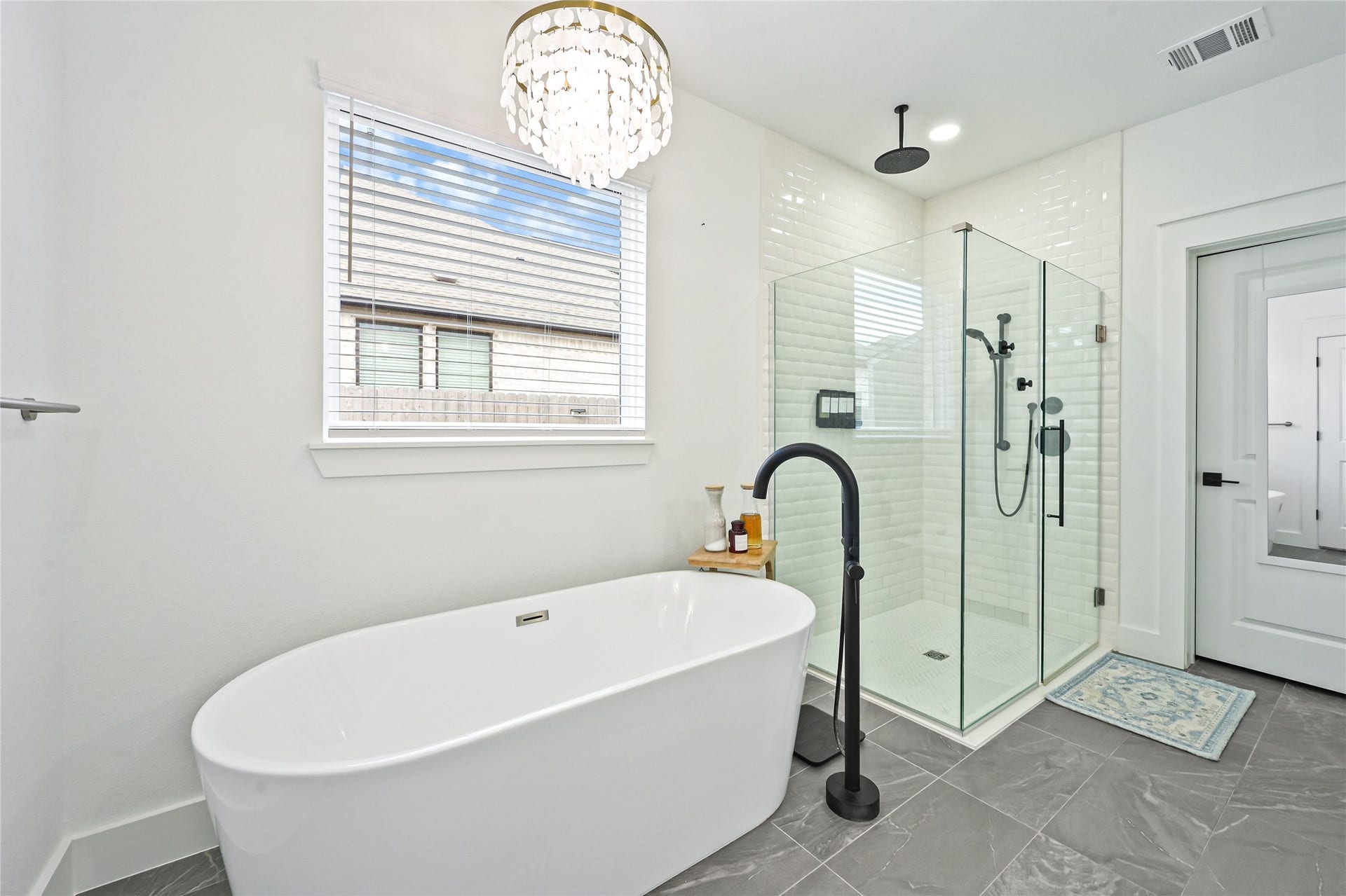4121 Hazy Rock Lane, League City, TX 77573 stunning spa-inspired primary bathroom, spacious glass-enclosed walk-in shower