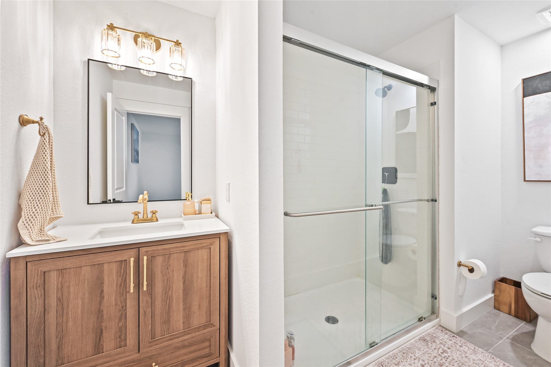 4121 Hazy Rock Lane, League City, TX 77573 glass-enclosed walk-in shower with contemporary fixtures and beautiful tilework