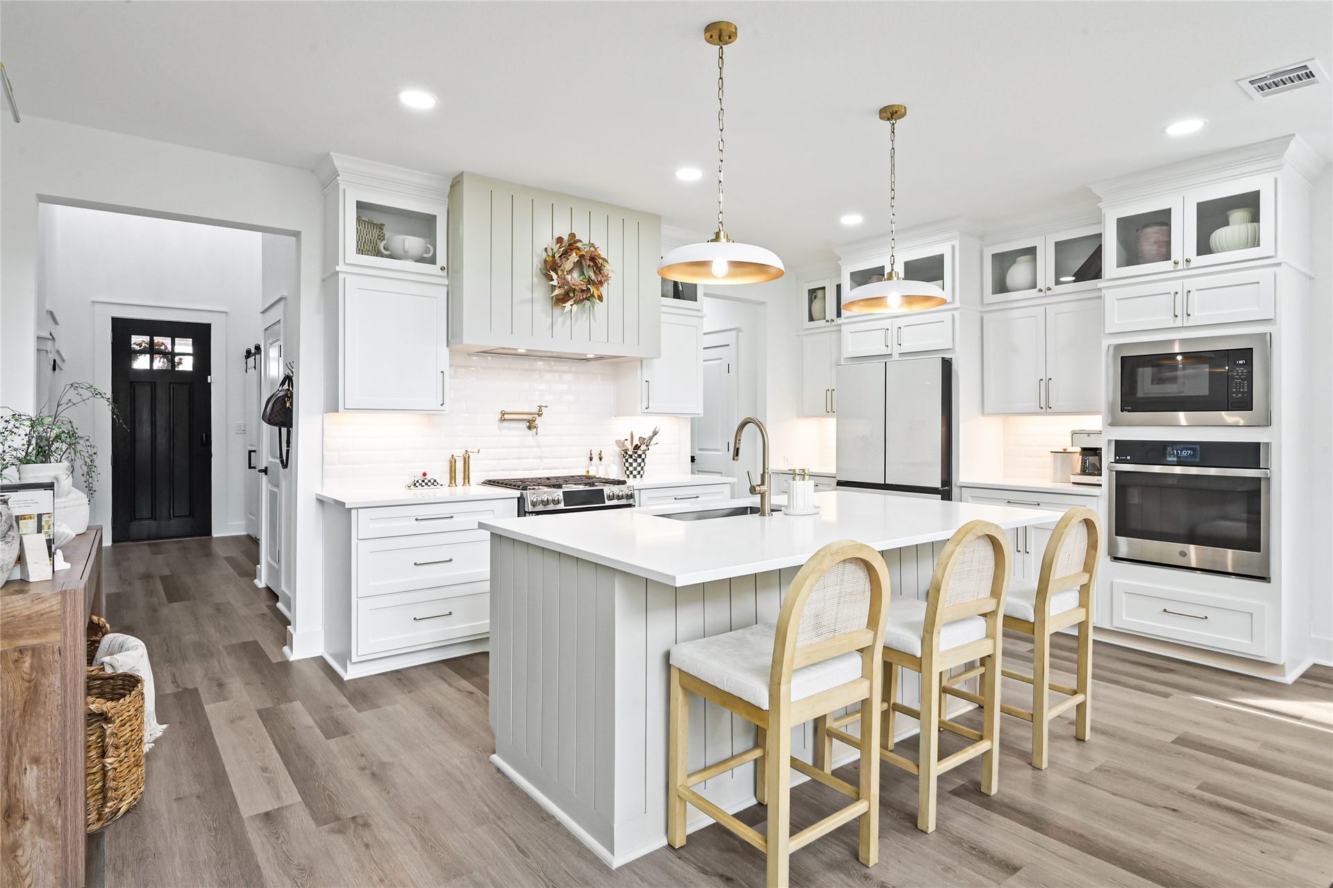 4121 Hazy Rock Lane, League City, TX 77573 Professional-style gas range, white subway tile backsplash, under-cabinet lighting, and abundant storage