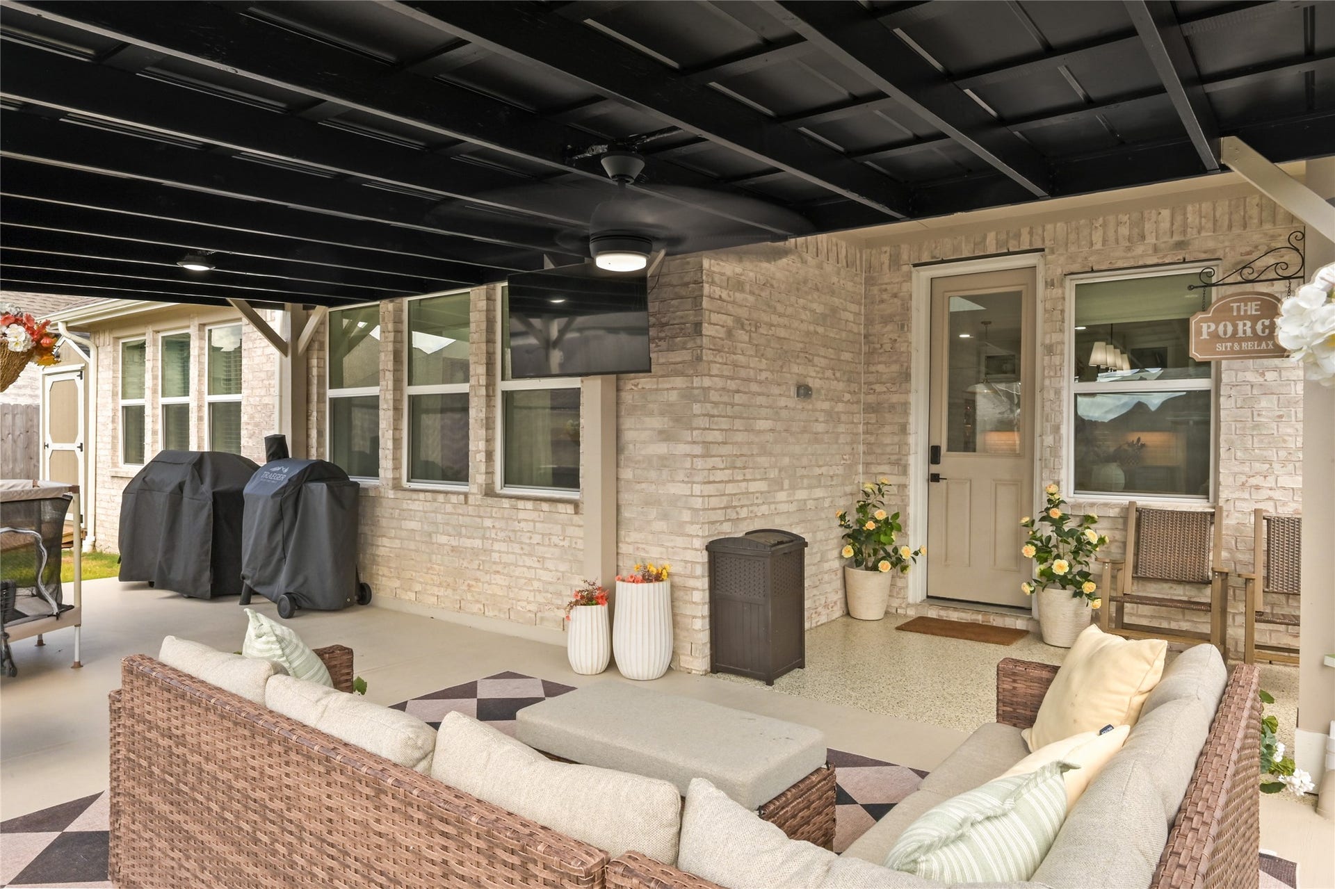 4121 Hazy Rock Lane, League City, TX 77573 welcoming space for outdoor dining, relaxing, or hosting gatherings while enjoying views of the backyard.