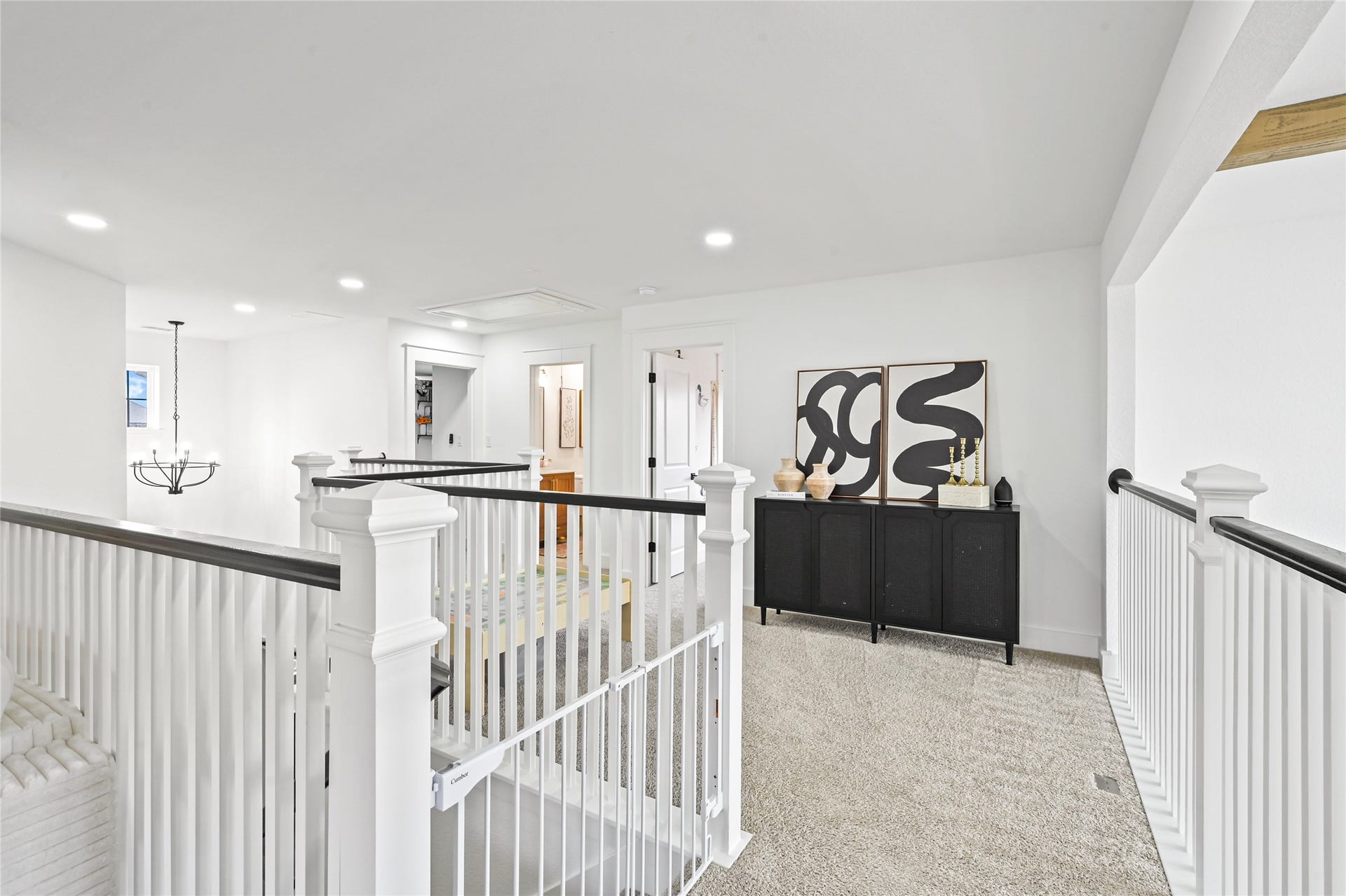 4121 Hazy Rock Lane, League City, TX 77573 Upstairs loft and second-floor landing offers an elegant combination of open space, architectural charm, and modern sophistication
