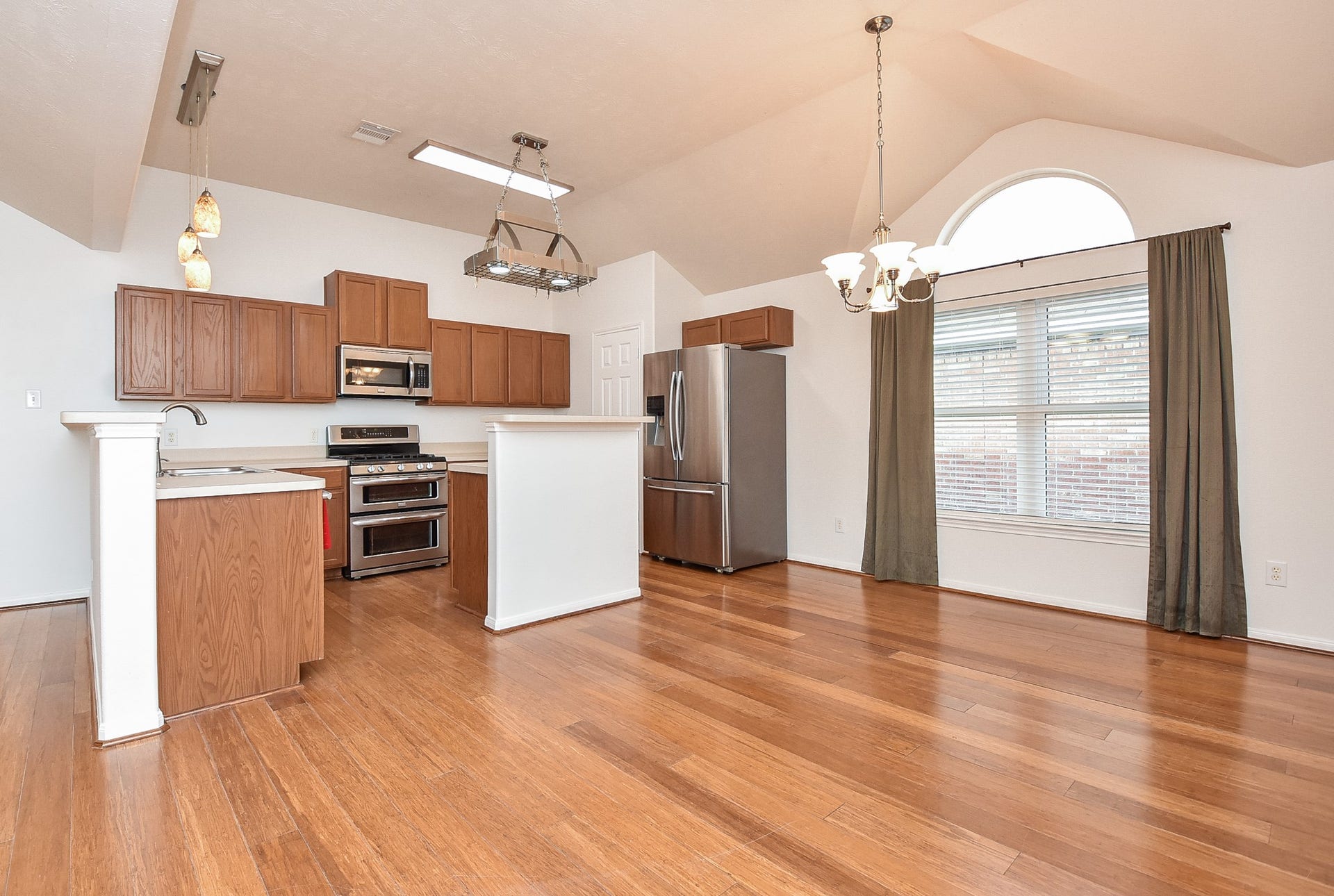 6730 Albion Cresent Drive, Katy, TX 77449 Kitchen with island and double oven. Refrigerator included.