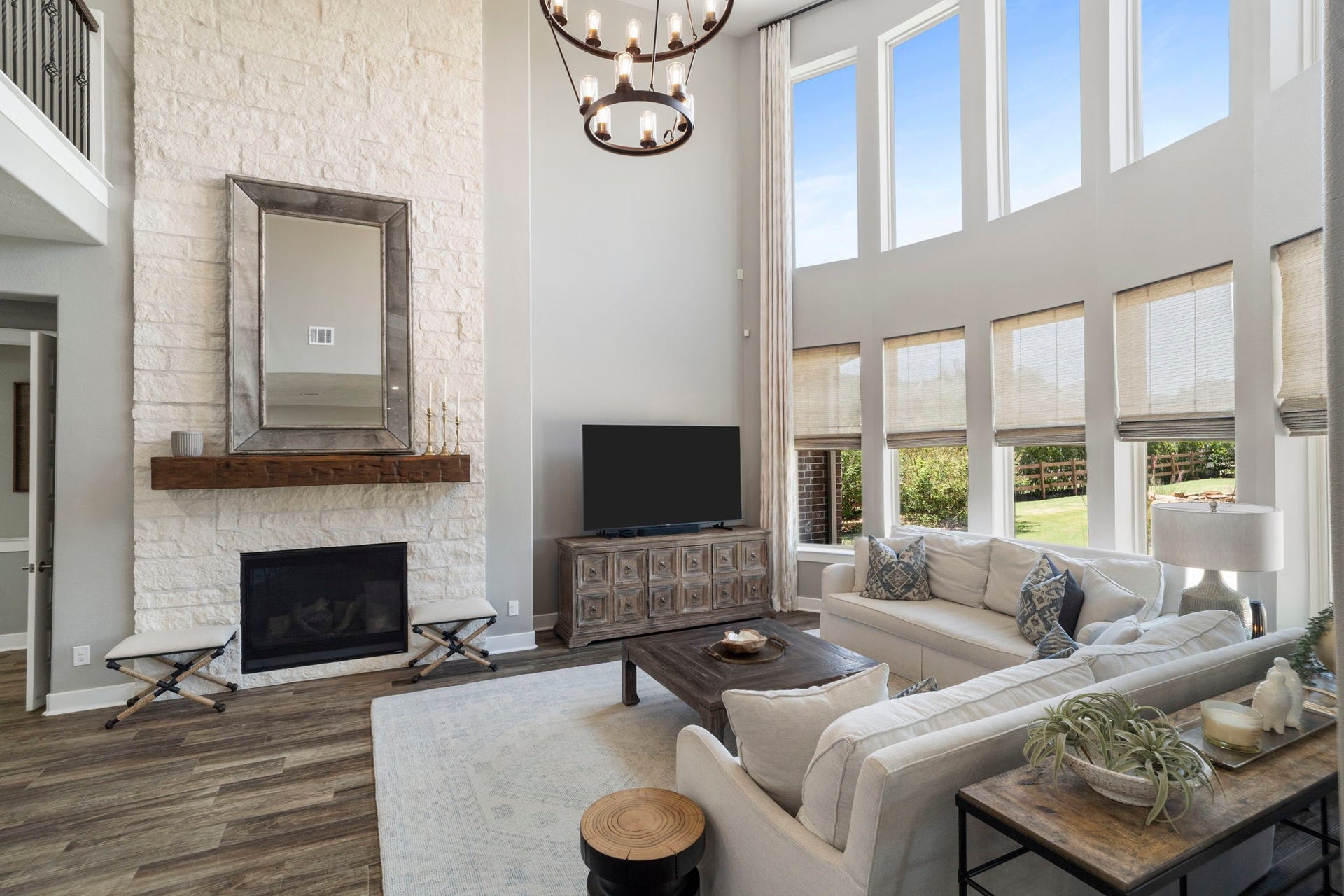 29826 Deer Crest Lane, Fulshear, TX 77406 A floor-to-ceiling stone fireplace with a substantial wood mantel creates a beautiful focal point in the family room.