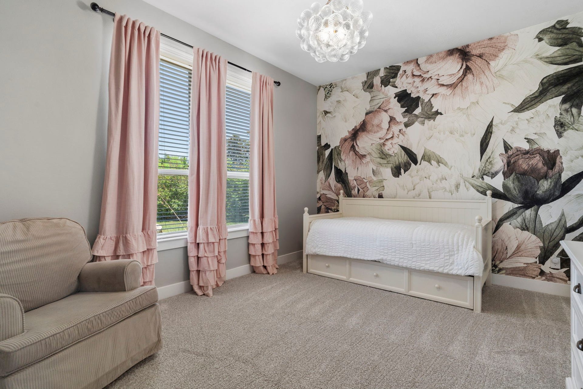 29826 Deer Crest Lane, Fulshear, TX 77406 A spacious secondary bedroom conveniently located downstairs features new carpet, a statement accent wall & designer lighting.