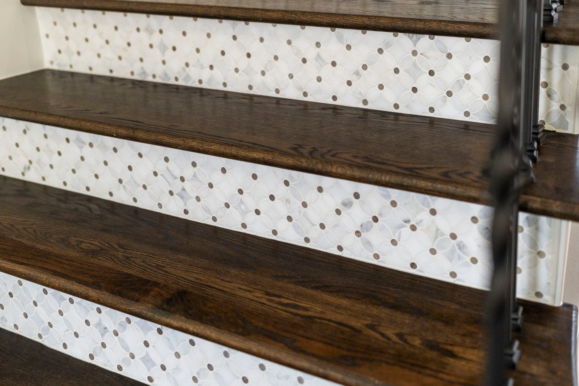 29826 Deer Crest Lane, Fulshear, TX 77406 Custom tiled stair risers add an unexpected designer detail, beautifully paired with rich wood treads & wrought iron railing.