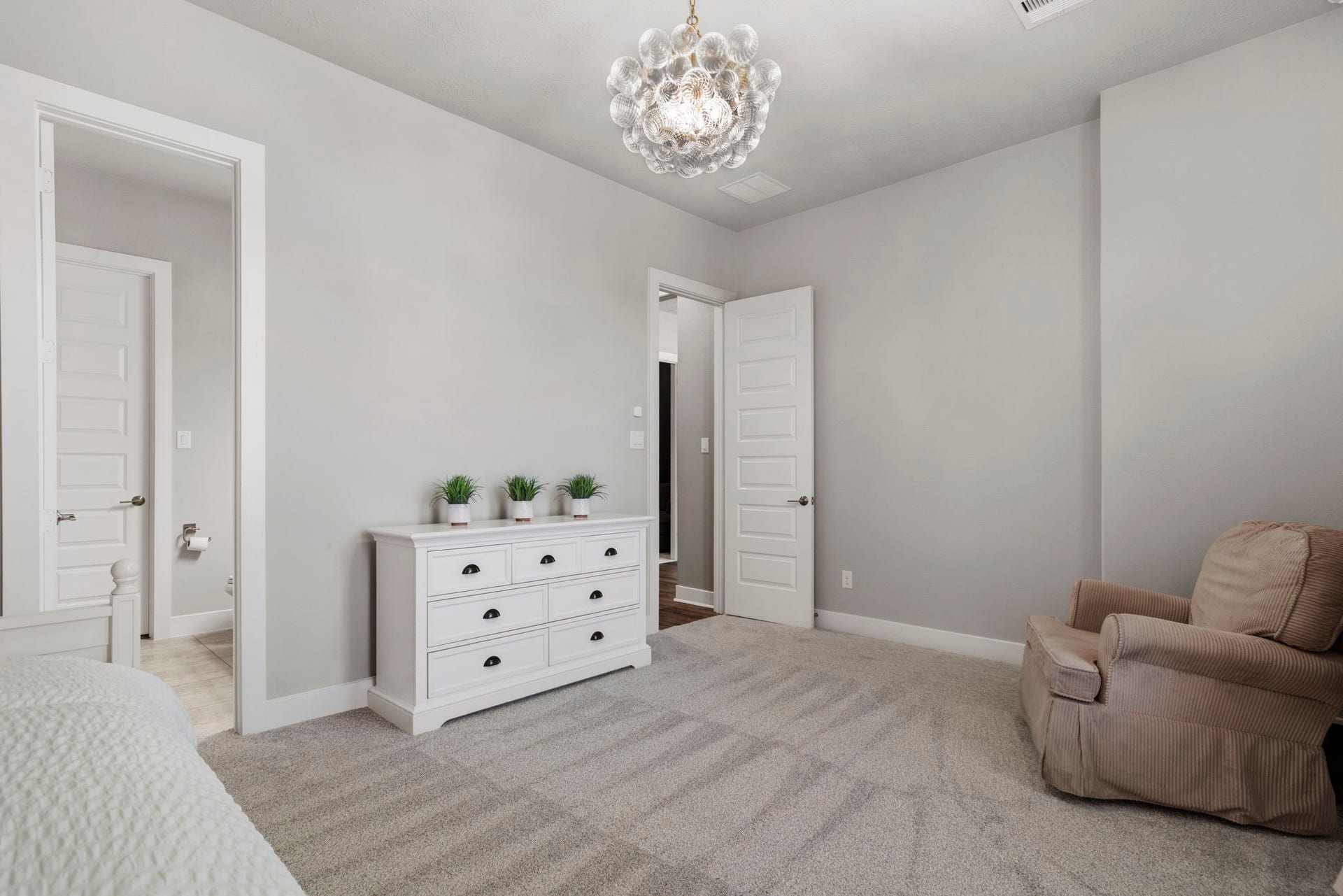 29826 Deer Crest Lane, Fulshear, TX 77406 The downstairs secondary bedroom highlights its private en-suite bath, offering added comfort & privacy for family or guests.