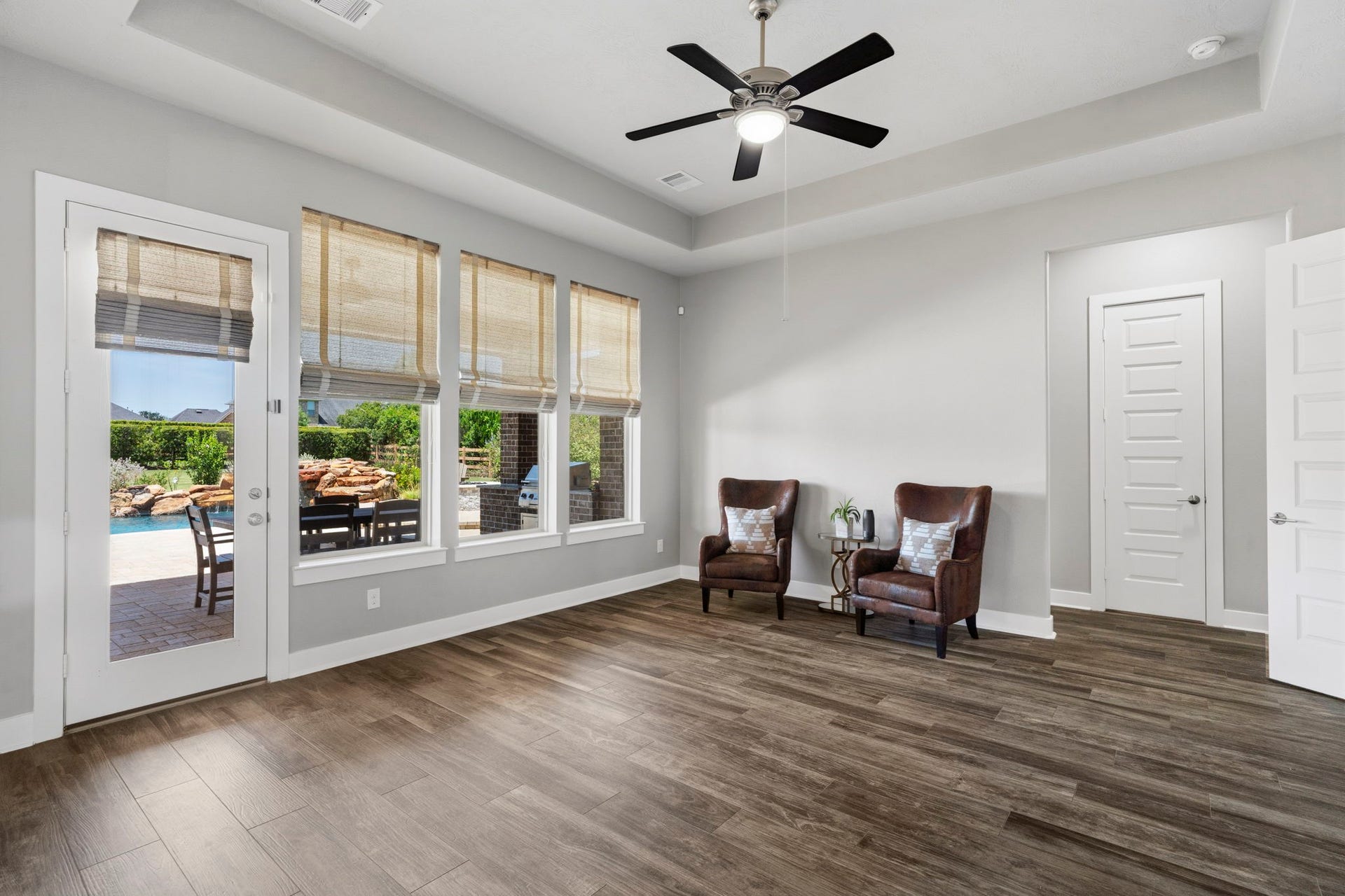 29826 Deer Crest Lane, Fulshear, TX 77406 Another view of the downstairs flex space highlights its generous size, backyard access & pool viewsideal for a game room, playroom or additional living area.