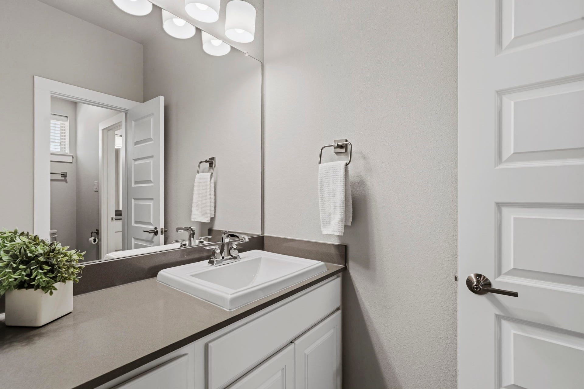 29826 Deer Crest Lane, Fulshear, TX 77406 A private en-suite bath offers a spacious vanity, modern fixtures & clean, neutral finishes.