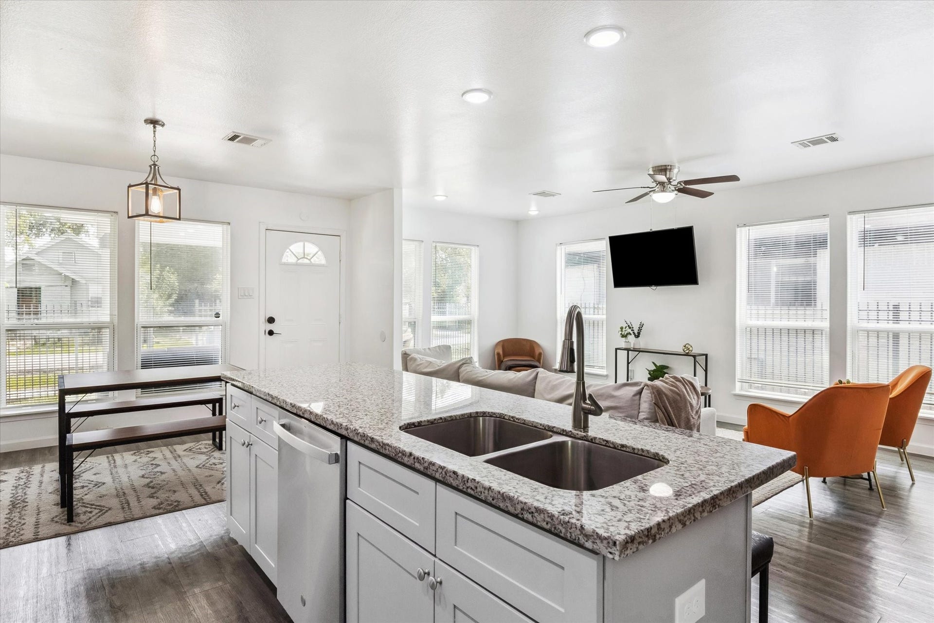 2631 Stevens Street, Houston, TX 77026 An open-concept layout filled with natural light connects the kitchen, dining, and living areas seamlessly. Large windows and modern finishes create a bright, inviting space ideal for both relaxing and entertaining.