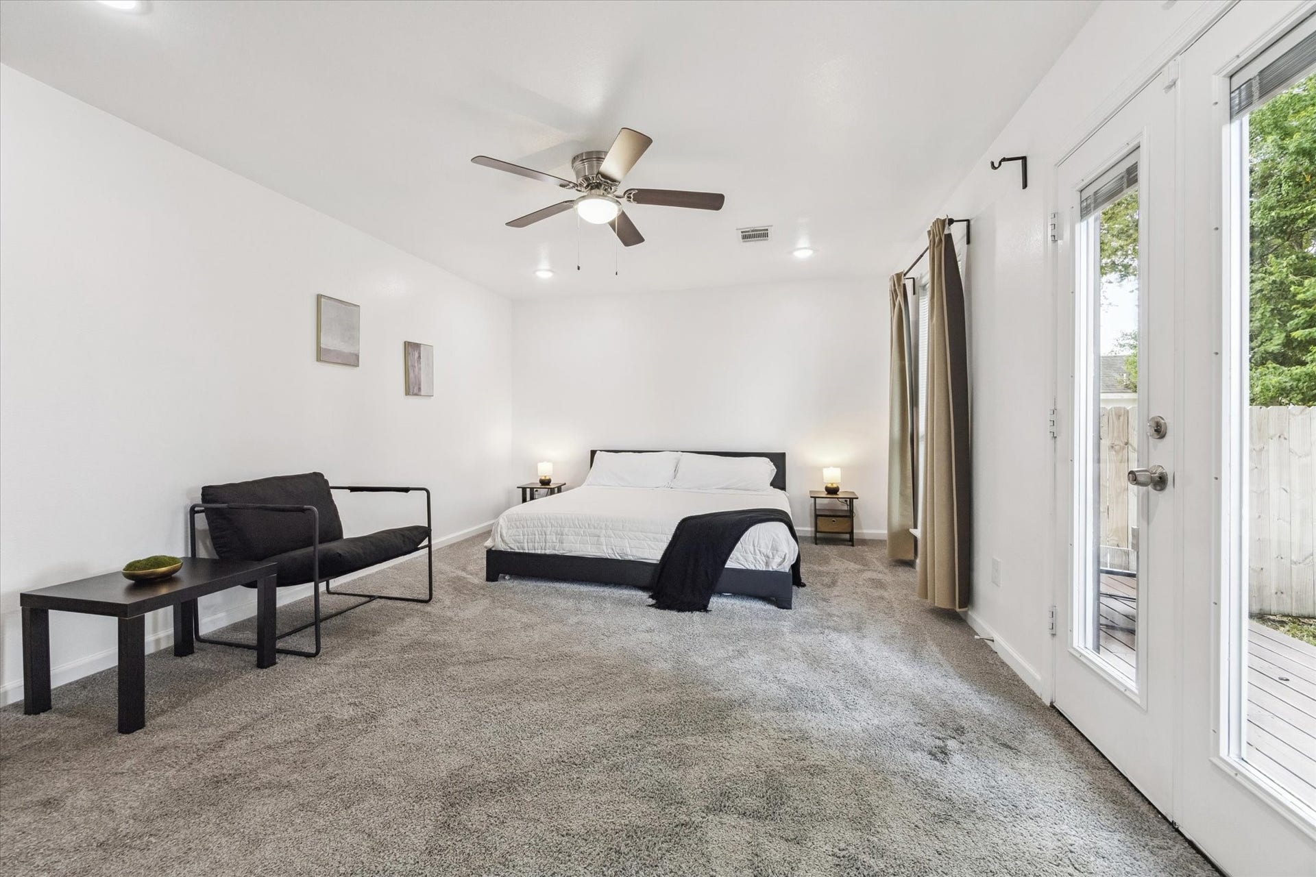 2631 Stevens Street, Houston, TX 77026 The primary bedroom is generously sized with plenty of room to stretch out. It features recessed lighting, a ceiling fan with light kit, and direct access to a large outdoor deckideal for morning coffee or winding down in the evening.