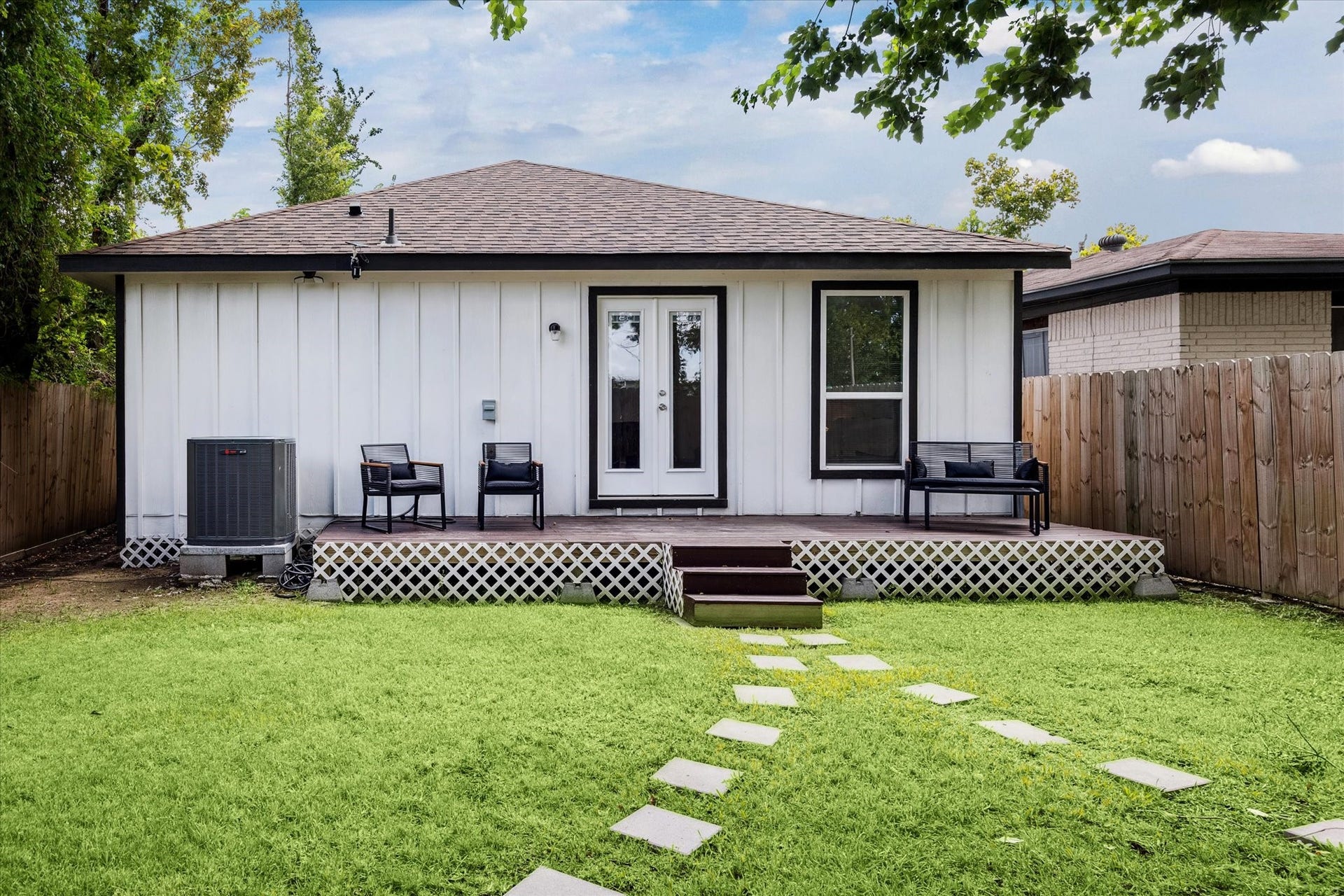 2631 Stevens Street, Houston, TX 77026 The fenced backyard features a deck with French door access, offering the perfect spot for outdoor seating or weekend gatherings. A private green space provides plenty of room for relaxation or play.