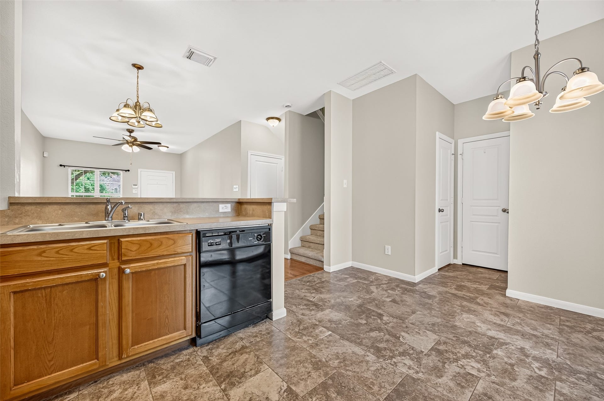The open layout keeps everyone connected, making it easy to prep meals while still being part of the conversation and entertaining. A half bath and laundry room are located just off the breakfast area.