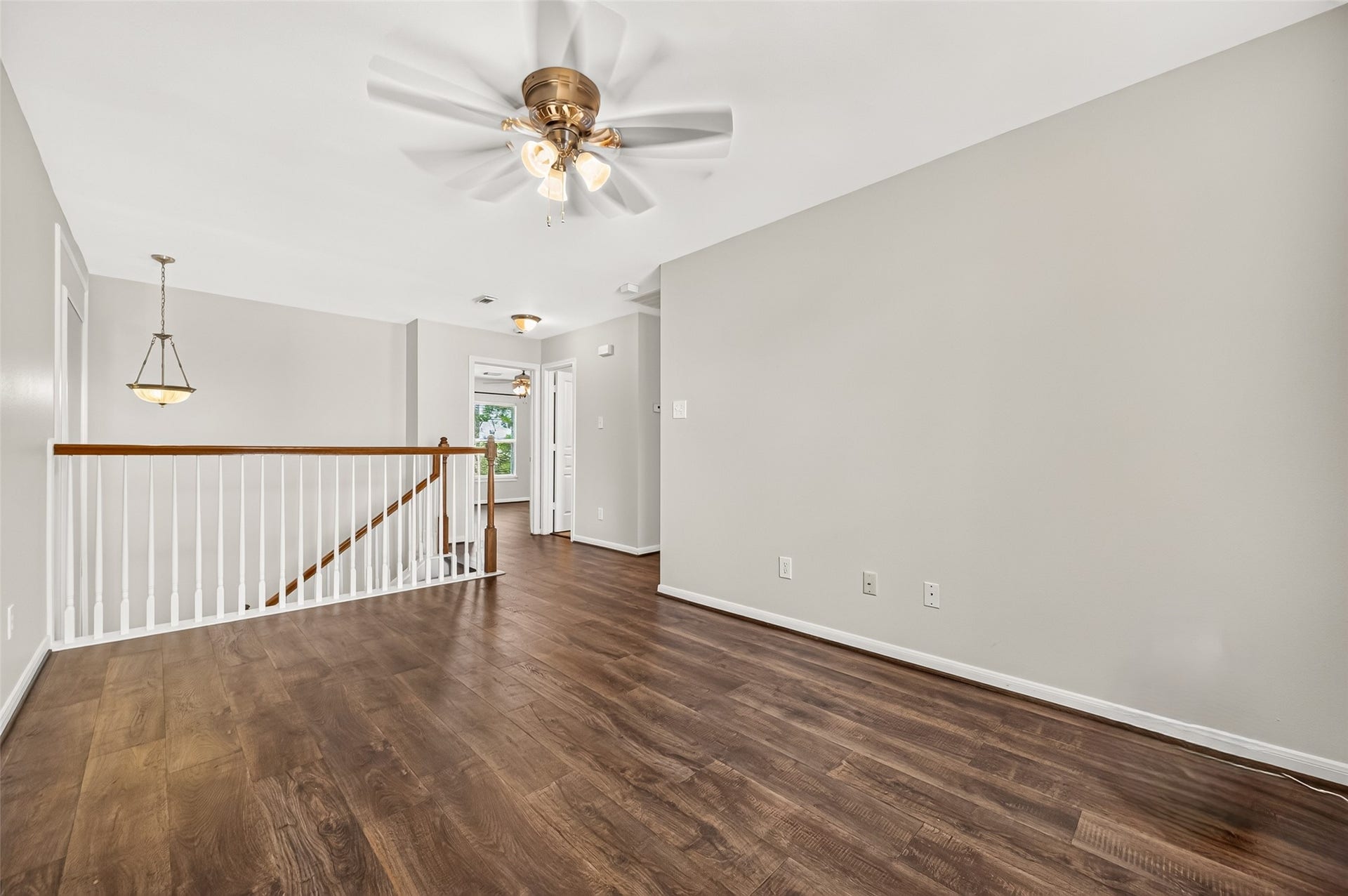 Versatile upstairs game room or flex space features durable vinyl plank flooring (new 2023) and plenty of room for a home office, media area, or second living space.
