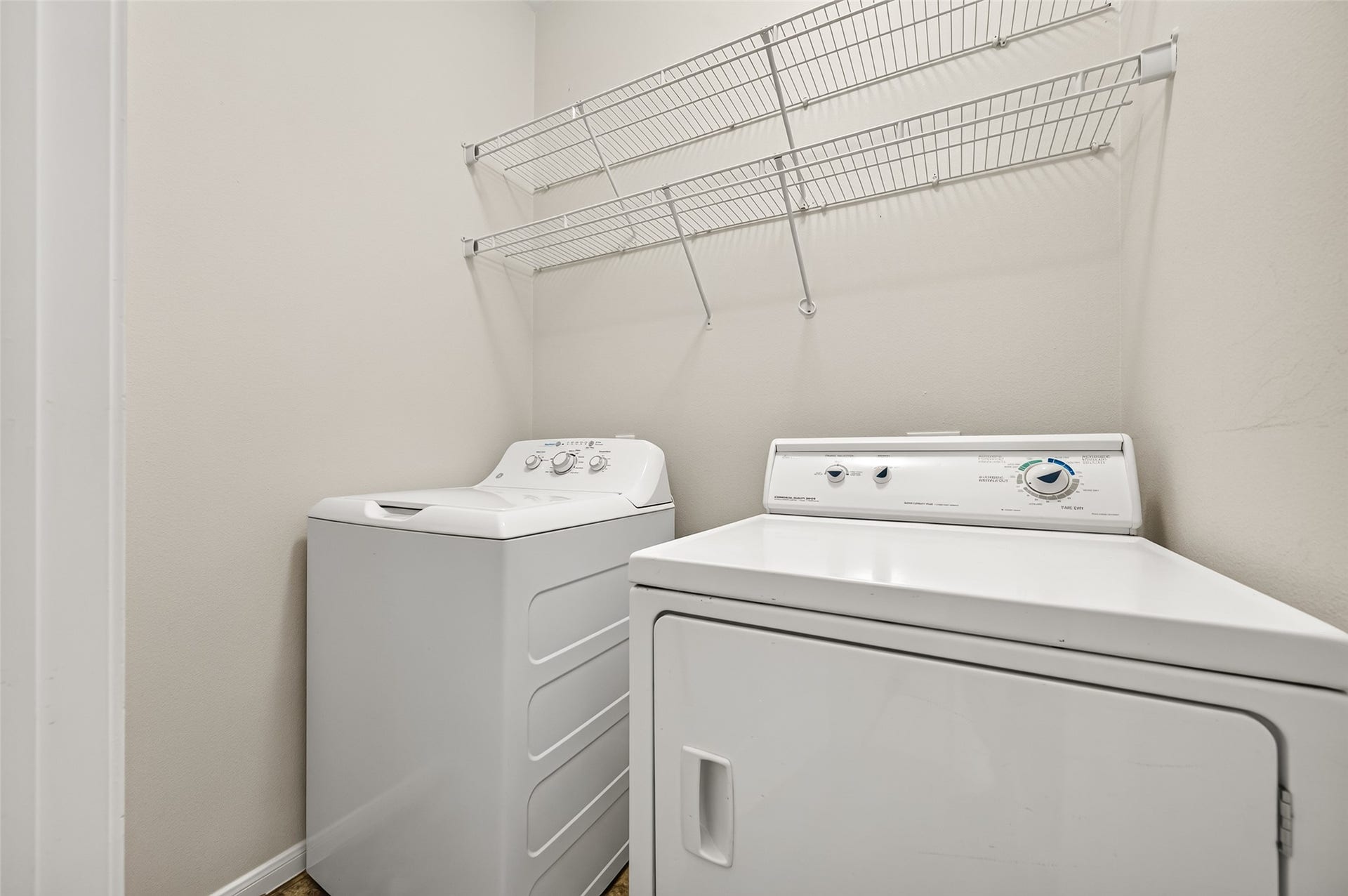 Enjoy the ultimate convenience of a dedicated laundry space equipped with washer and dryer hookups. Built-in wire shelving overhead maximizes vertical storage, keeping all of your essentials organized and within easy reach.
