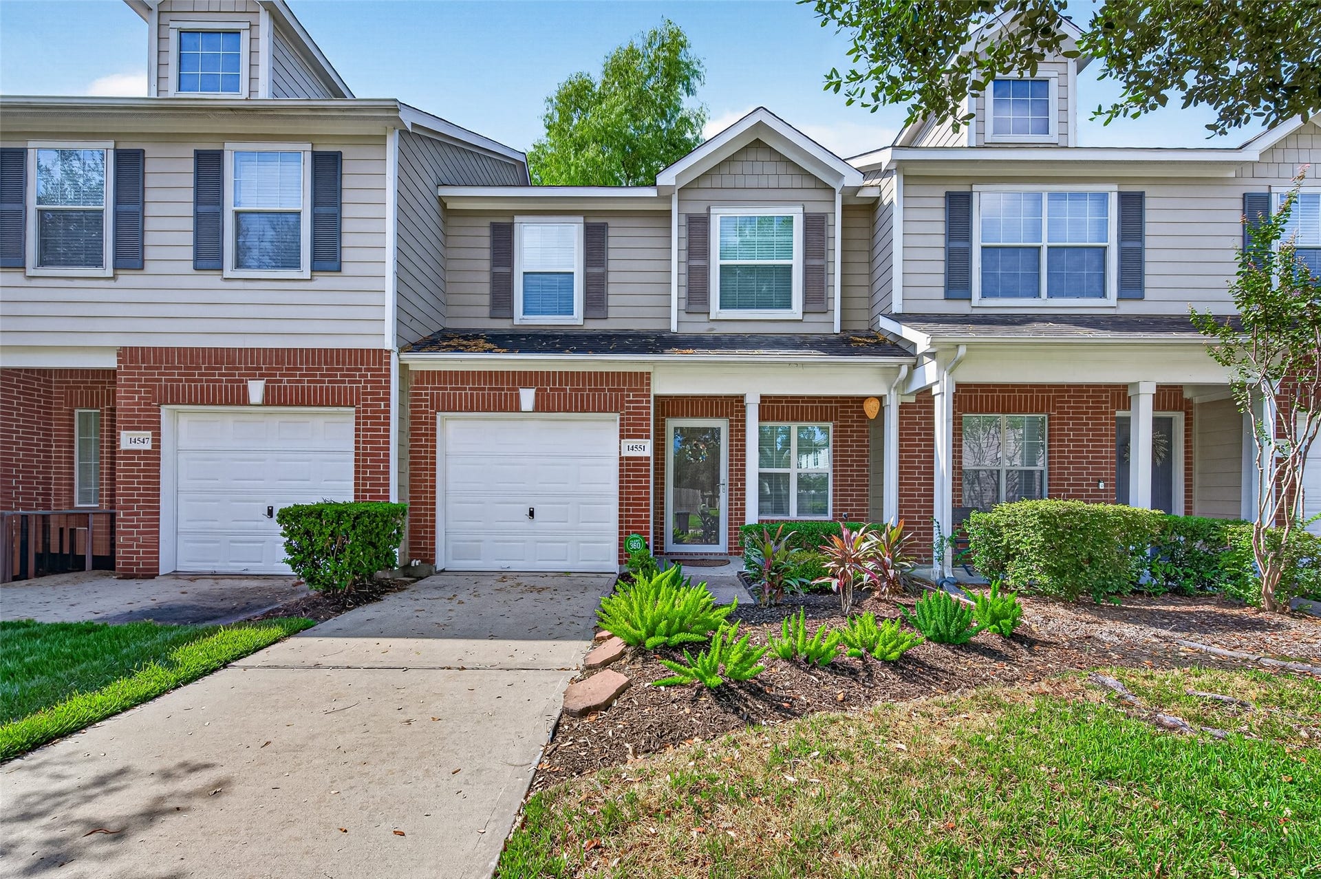 Welcome home to this charming townhome featuring classic brick accents, meticulous landscaping, a NEW GLASS STORM DOOR (2024), NEWER ROOF (2020), ALL NEW E-GLASS DOUBLE-PANE WINDOWS (2024), plus a RADIANT BARRIER AND ADDITIONAL ATTIC INSULATION with a lifetime transferable warranty (2017). A covered entry and attached garage complete this attractive, move-in-ready exterior. Front & Back lawn maintained by the HOA.  NO MOWING FOR THE NEW OWNER!!