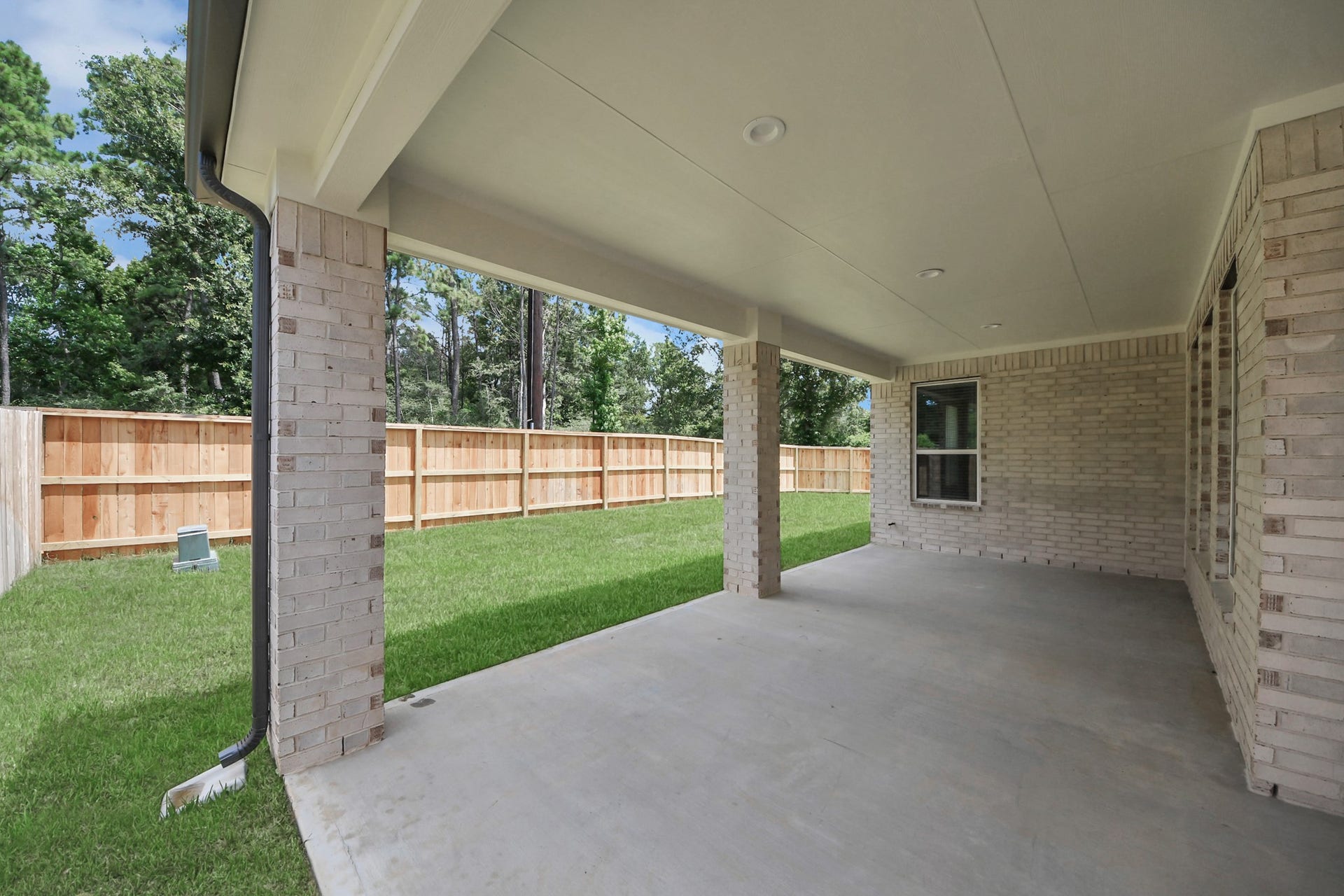 3205 Skerne Spring Drive, Spring, TX 77373 Experience outdoor living at its finest on this expansive covered patio, thoughtfully designed for BBQs and delightful outdoor dining. Sample photo of completed home with similar floor plan. Actual colors and selections may vary.