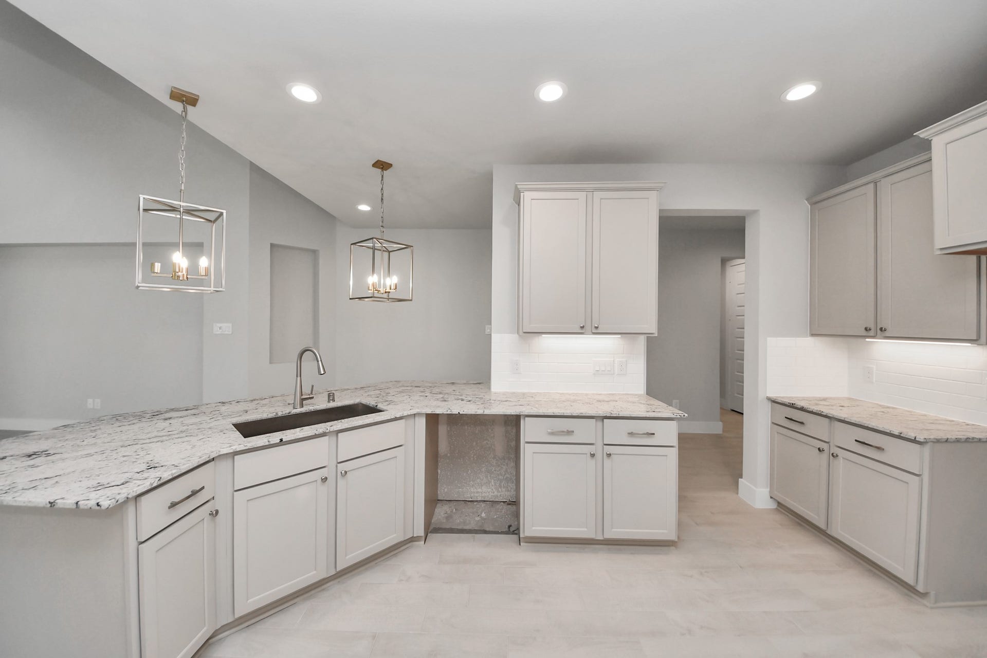 3205 Skerne Spring Drive, Spring, TX 77373 The kitchen is a culinary haven, featuring granite countertops, a tile backsplash, stainless steel appliances, 42 upper cabinets, and undercabinet lighting. Sample photo of completed home with similar floor plan. Actual colors and selections may vary.