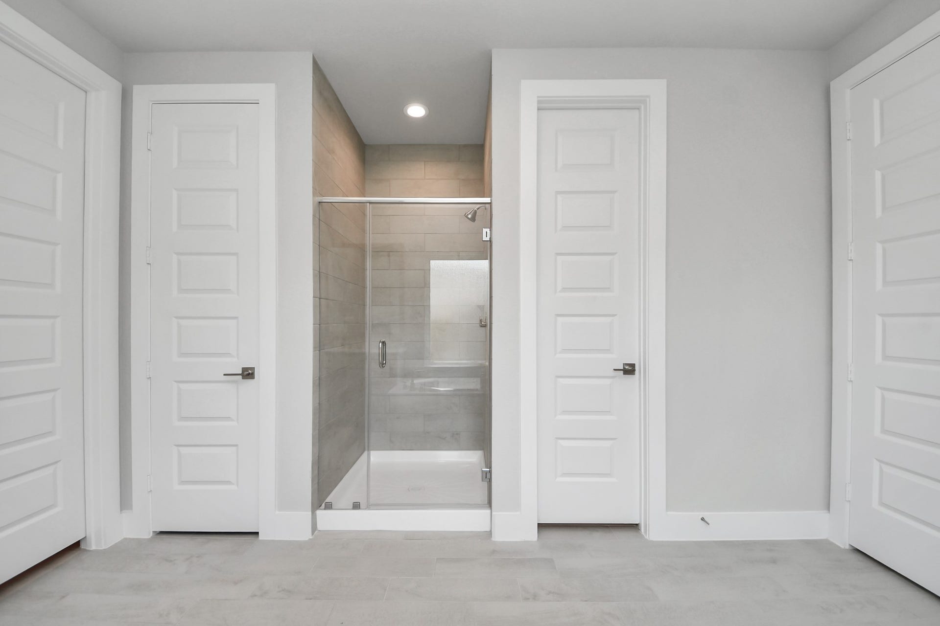3205 Skerne Spring Drive, Spring, TX 77373 Indulge in a spa-like retreat within the confines of this primary bathroom. Delight in a spacious walk-in shower enveloped in stylish tile surround, unwind in a separate garden tub adorned with custom detailing. Sample photo of completed home with similar floor plan. Actual colors and selections may vary.