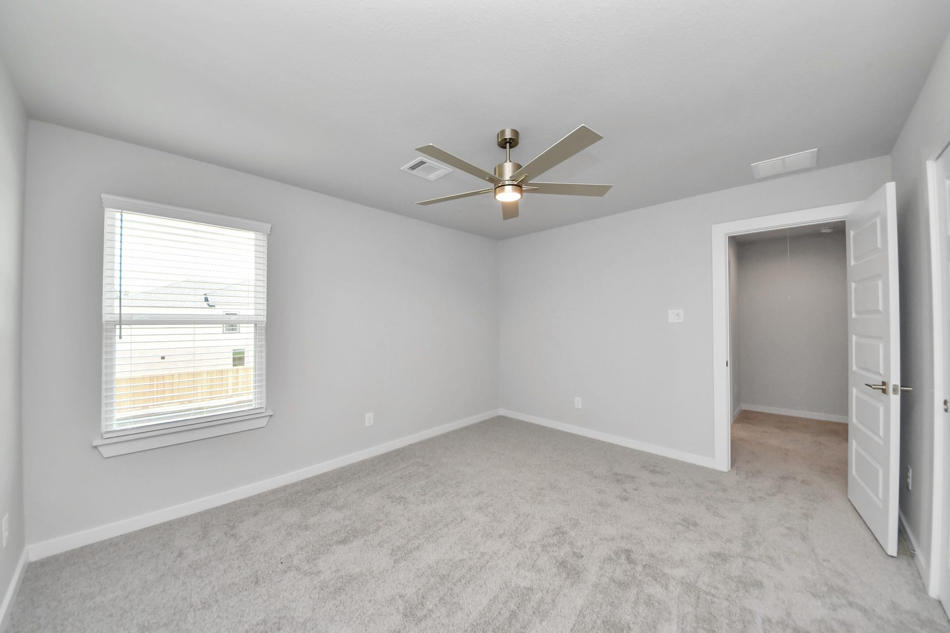 3205 Skerne Spring Drive, Spring, TX 77373 Generously sized secondary bedrooms featuring spacious closets, soft and inviting carpeting underfoot, large windows allowing plenty of natural light, and the added touch of privacy blinds for your personal retreat. Sample photo of completed home with similar floor plan. Actual colors and selections may vary.