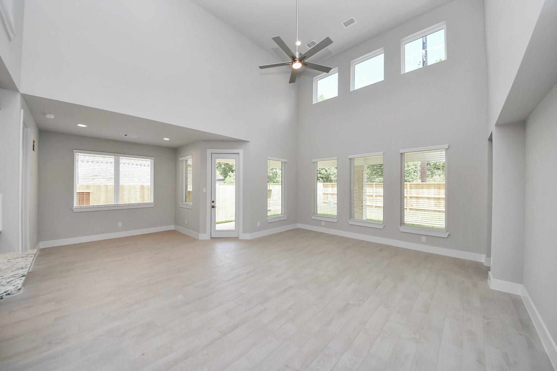 3205 Skerne Spring Drive, Spring, TX 77373 Relax and unwind in this inviting family room, illuminated by abundant natural light streaming in through tall windows, complemented by high ceilings and stunning flooring. Stay comfortable year-round with the gentle breeze from the ceiling fan, creating the perfect atmosphere for family gatherings. Sample photo of completed home with similar floor plan. Actual colors and selections may vary.