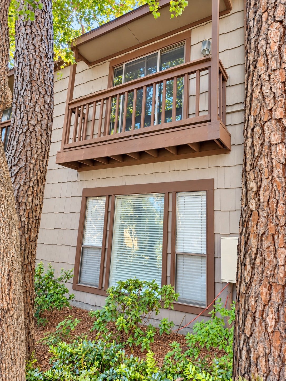 11711 Memorial Drive, #313, Houston, TX 77024 Charming Exterior with an upper covered balcony, large window beneath