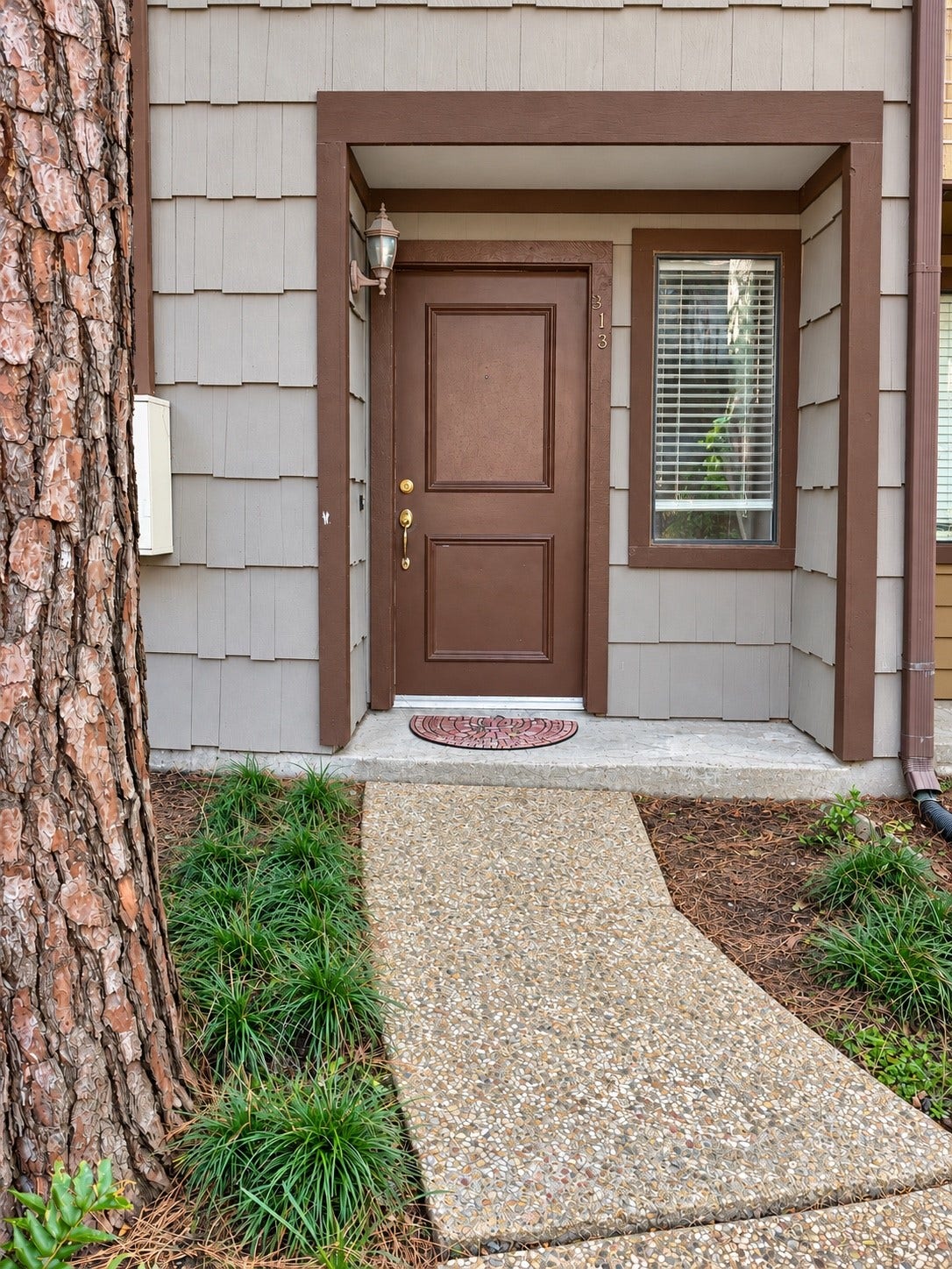 11711 Memorial Drive, #313, Houston, TX 77024 Covered entry with Charming walkway into your New Home #313
