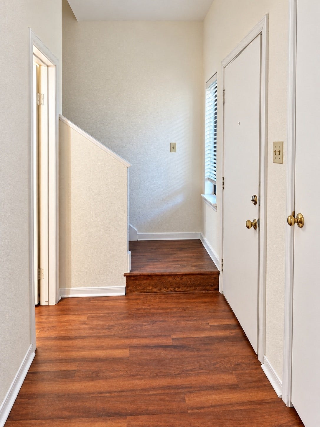 11711 Memorial Drive, #313, Houston, TX 77024 Entryway with wodded-look flooring,natural lighting and , a convenient coat closet.