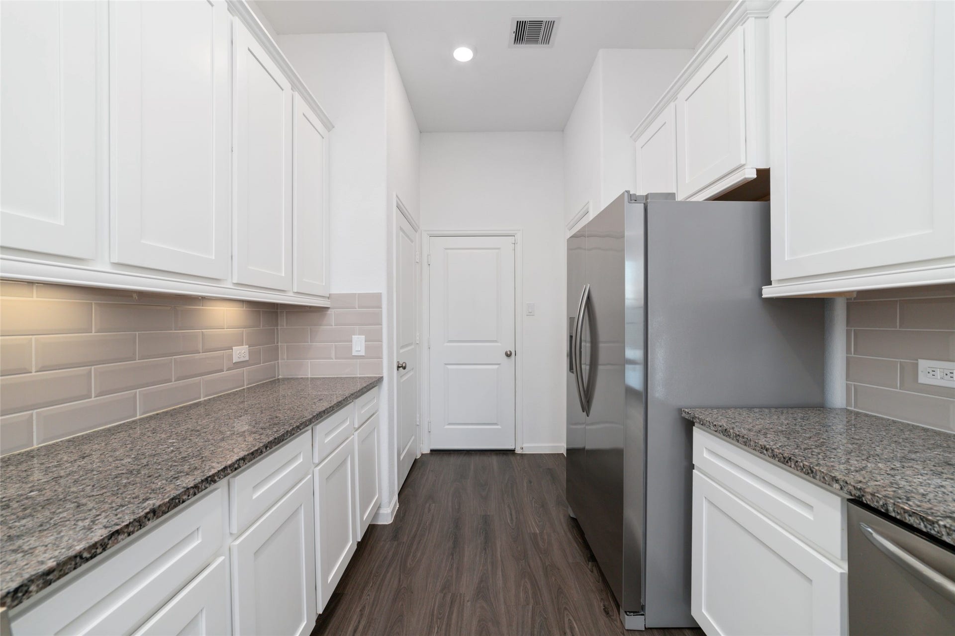 5719 Foggy Vine Court, Fulshear, TX 77441 Pantry on the left and right and door leading to the garage
